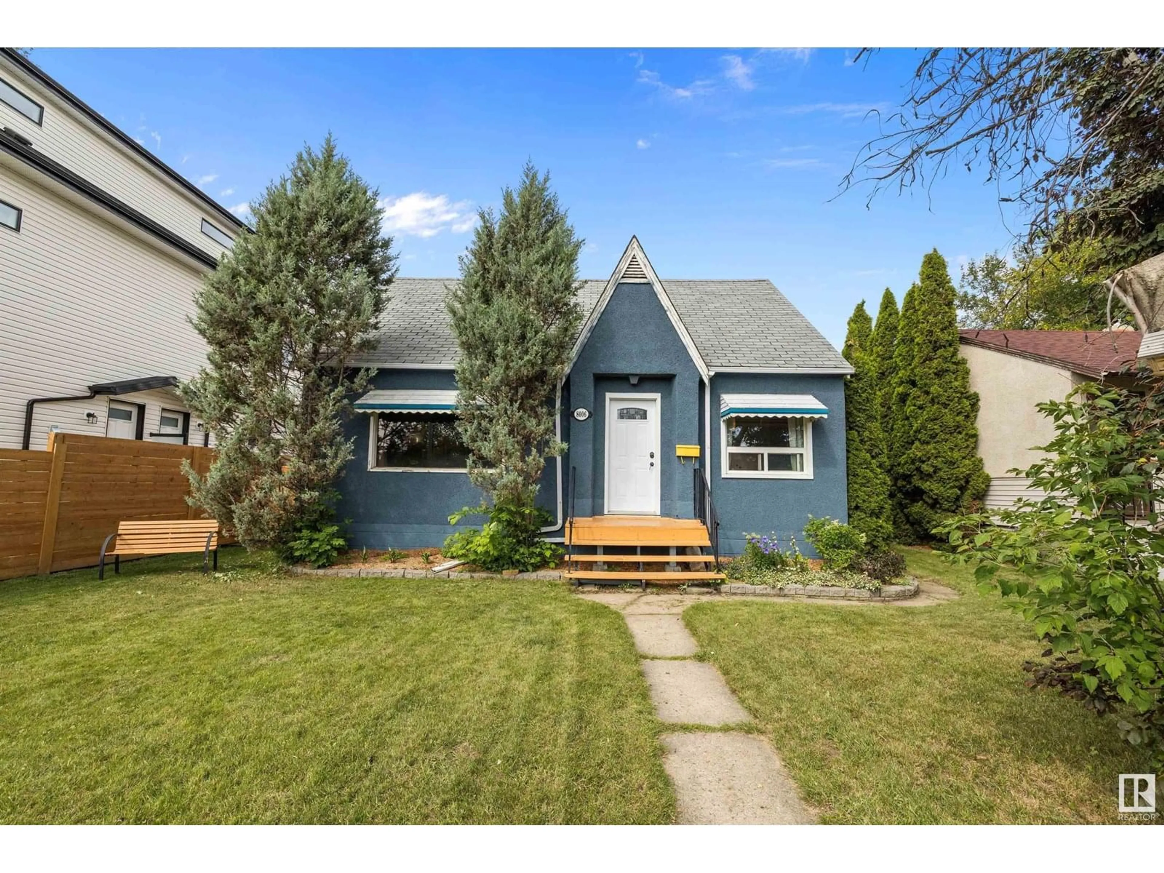Home with vinyl exterior material, street for 8006 75 ST, Edmonton Alberta T6C2G7
