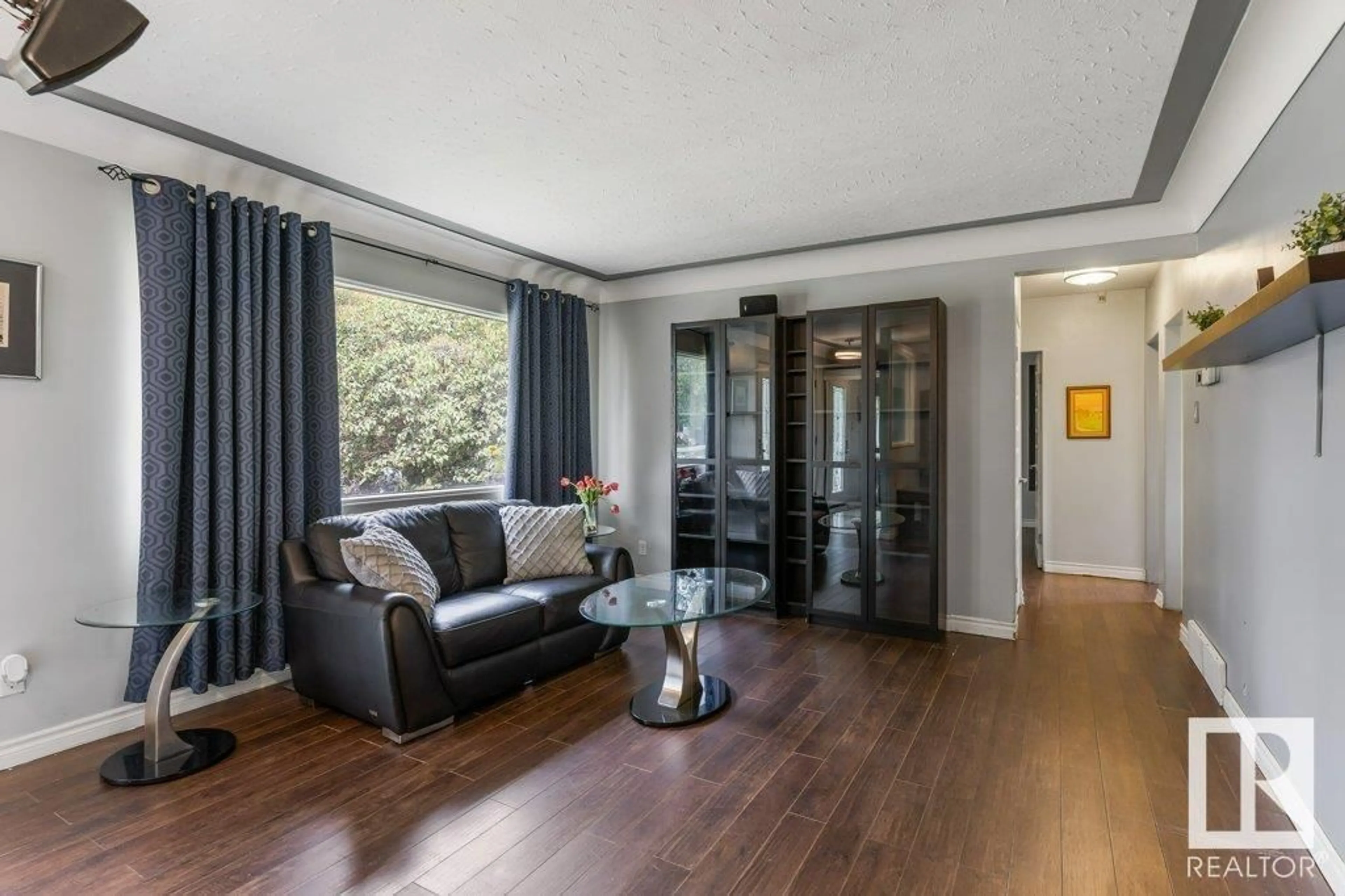 Living room with furniture, wood/laminate floor for 12427 75 ST, Edmonton Alberta T5B2C1