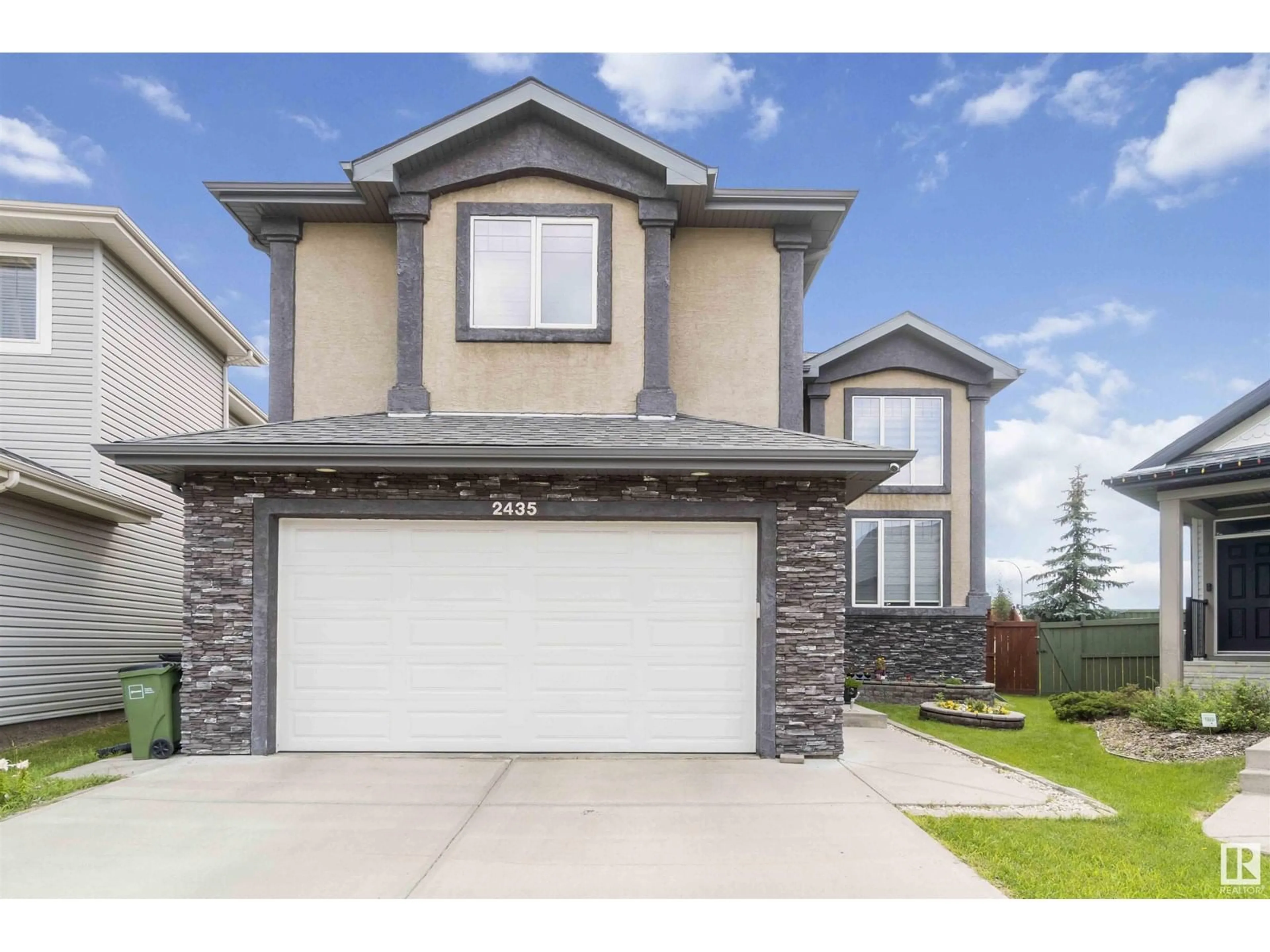 Home with vinyl exterior material, street for 2435 HAGEN WAY NW, Edmonton Alberta T6R3L5
