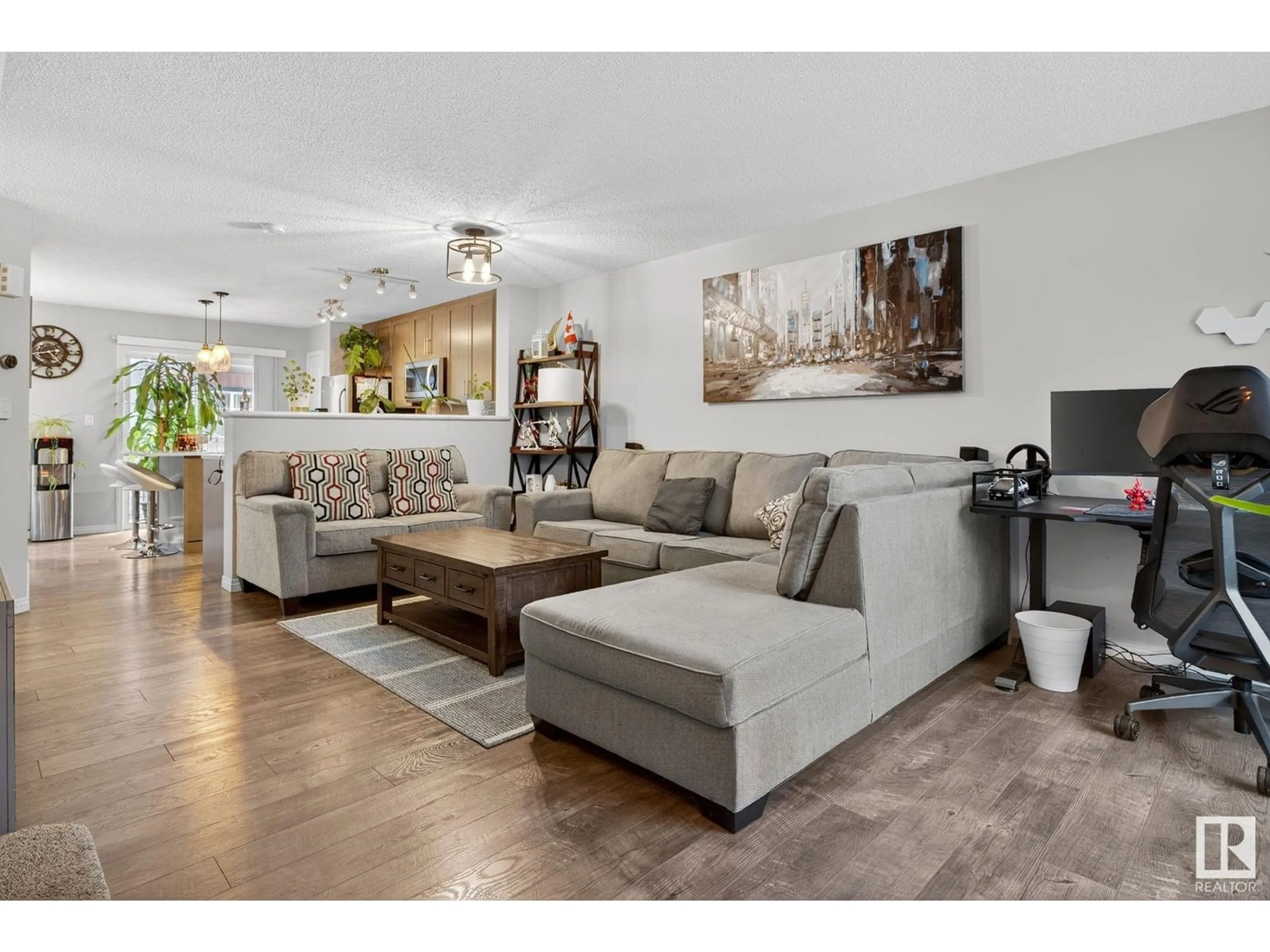 Living room with furniture, wood/laminate floor for 3305 - 80 ORCHARDS LINK LI, Edmonton Alberta T6X2H1