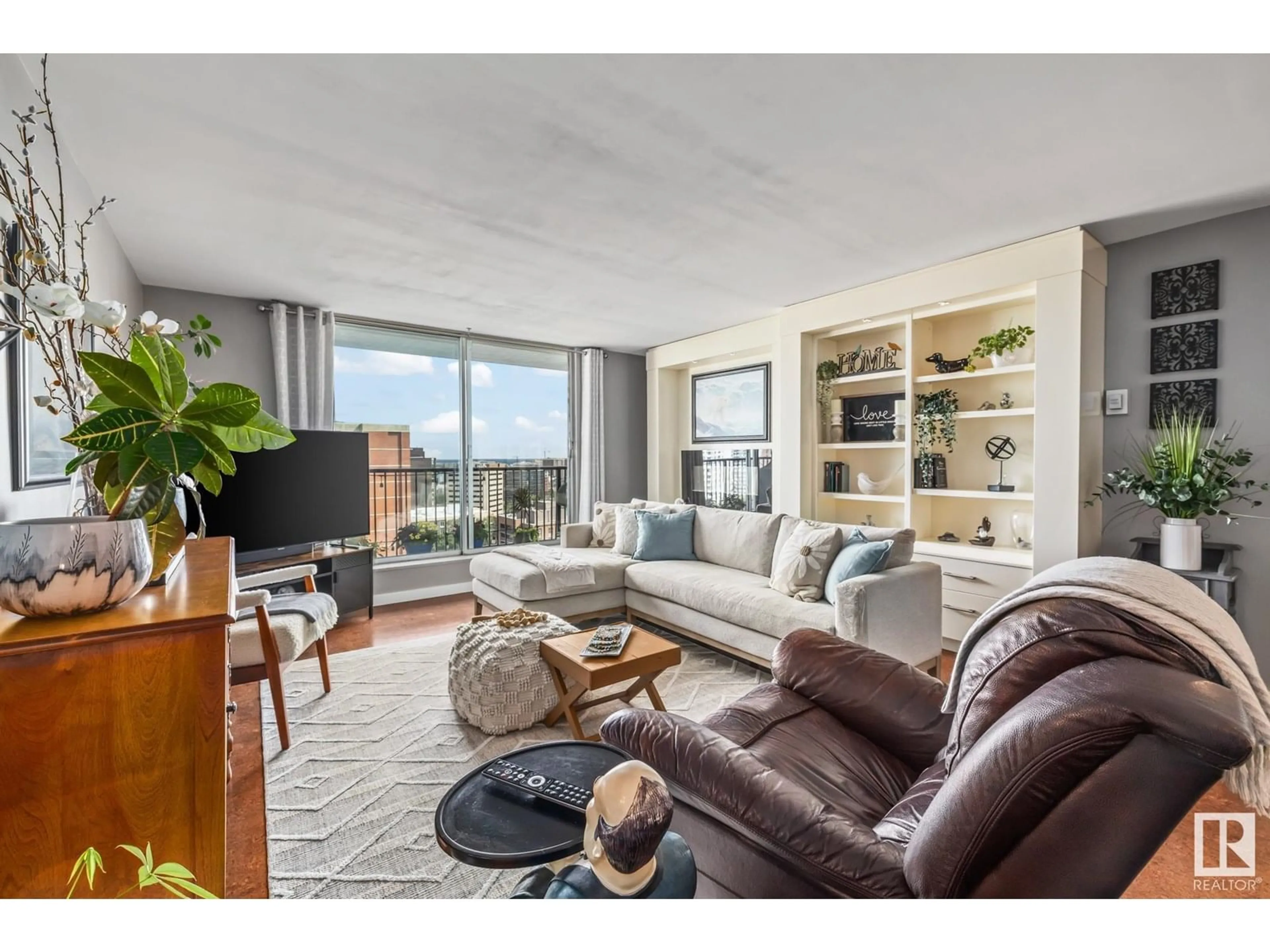 Living room with furniture, wood/laminate floor for 1605 99 AV NW, Edmonton Alberta T5K0H2