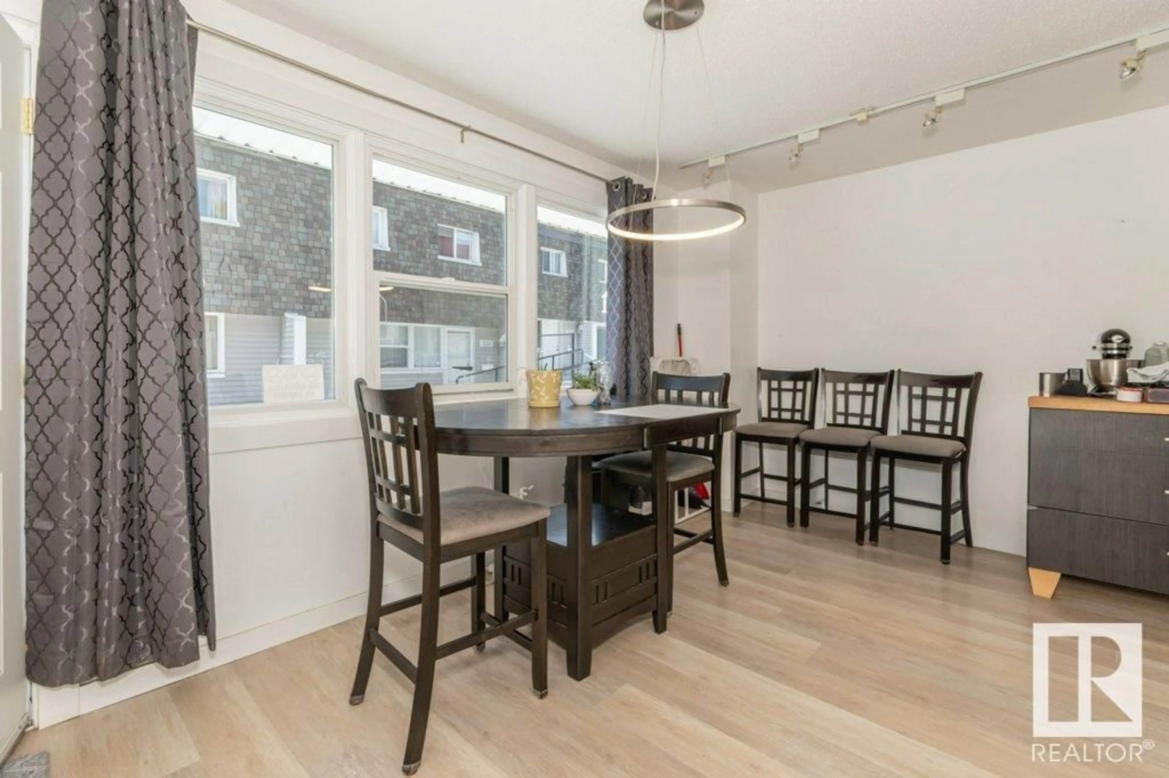 Dining room, wood/laminate floor for 509 VILLAGE ON THE GREEN GR, Edmonton Alberta T5A1H2