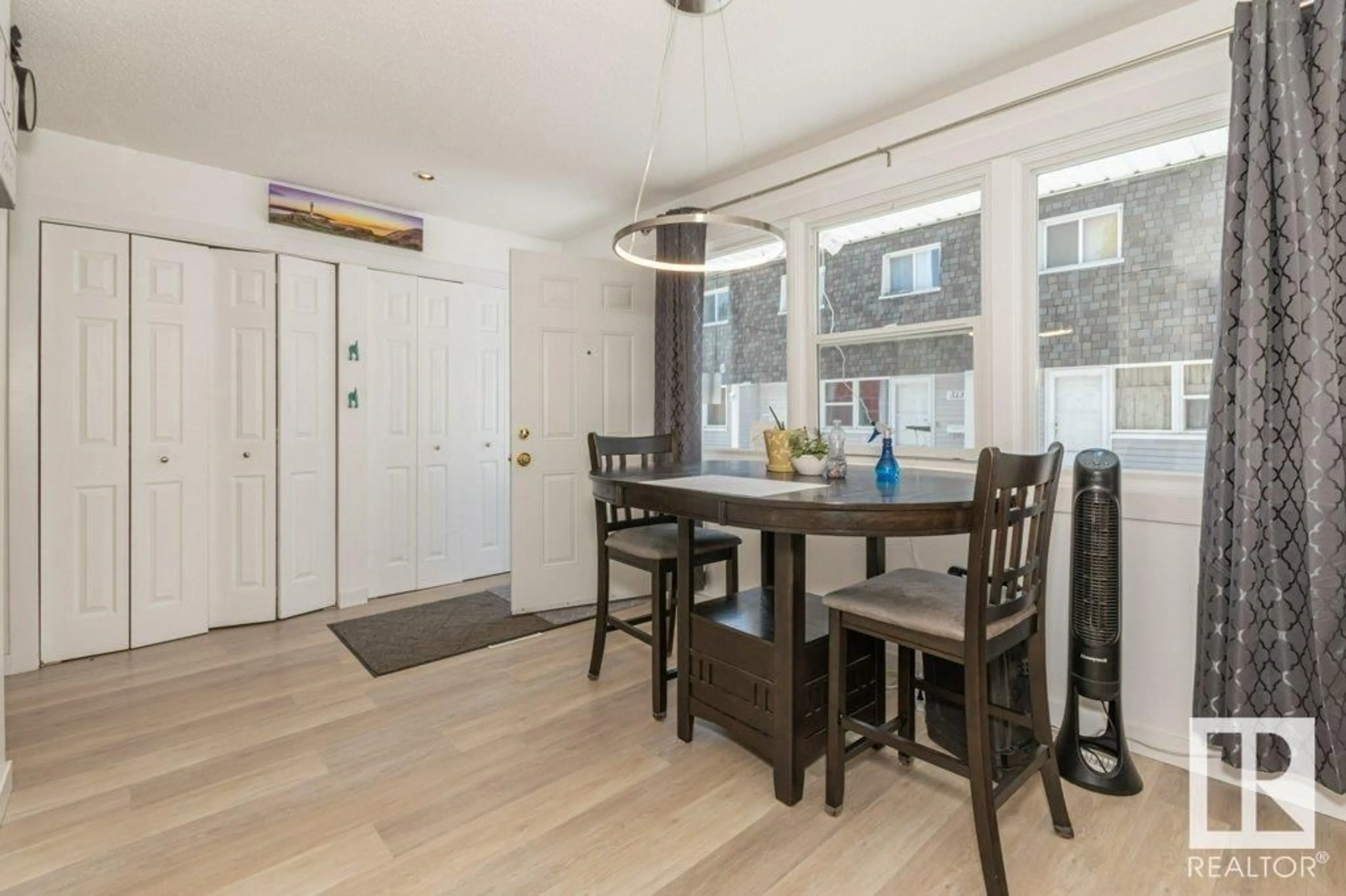 Dining room, wood/laminate floor for 509 VILLAGE ON THE GREEN GR, Edmonton Alberta T5A1H2