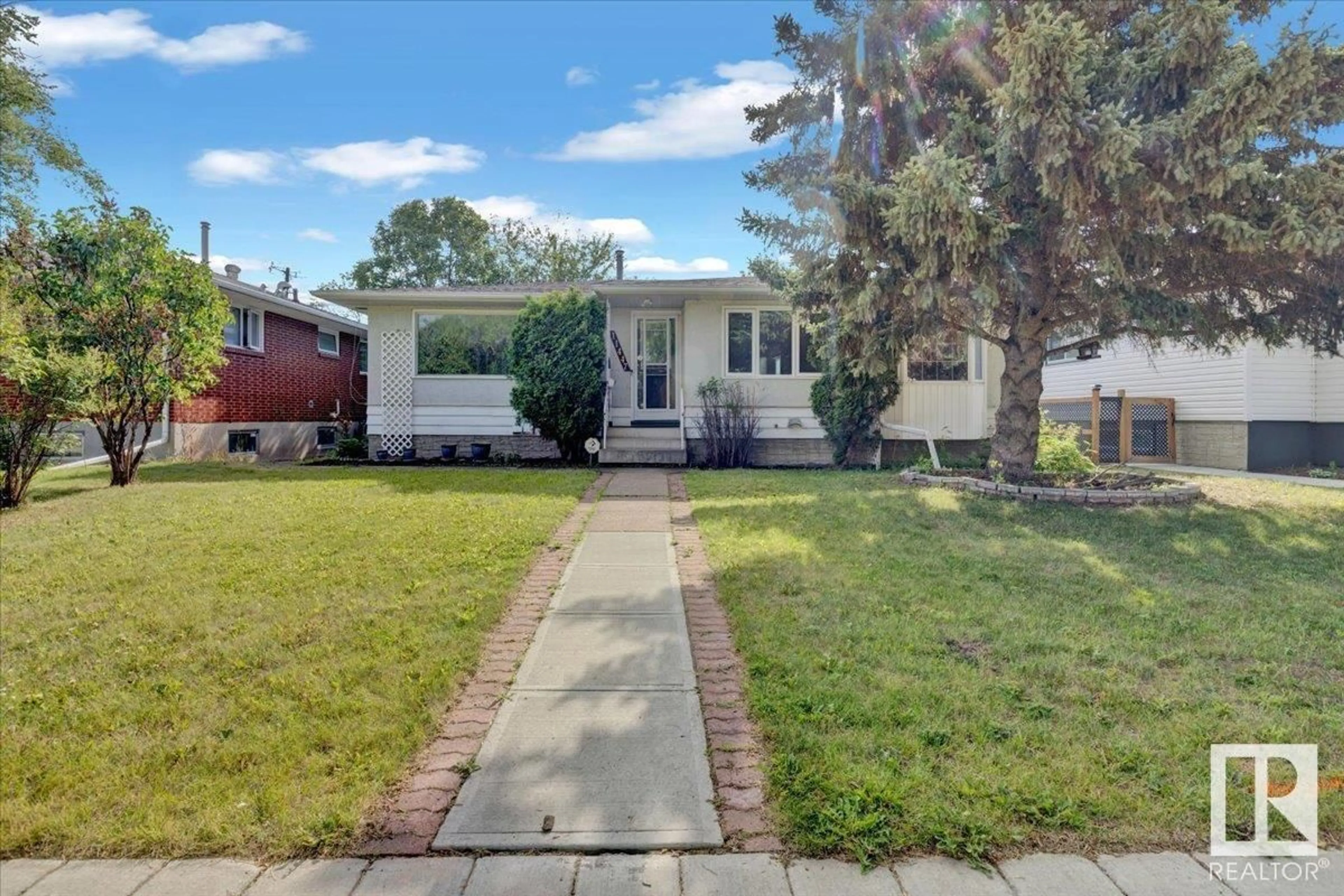 Home with vinyl exterior material, street for NW - 11447 127 ST, Edmonton Alberta T5M0V2