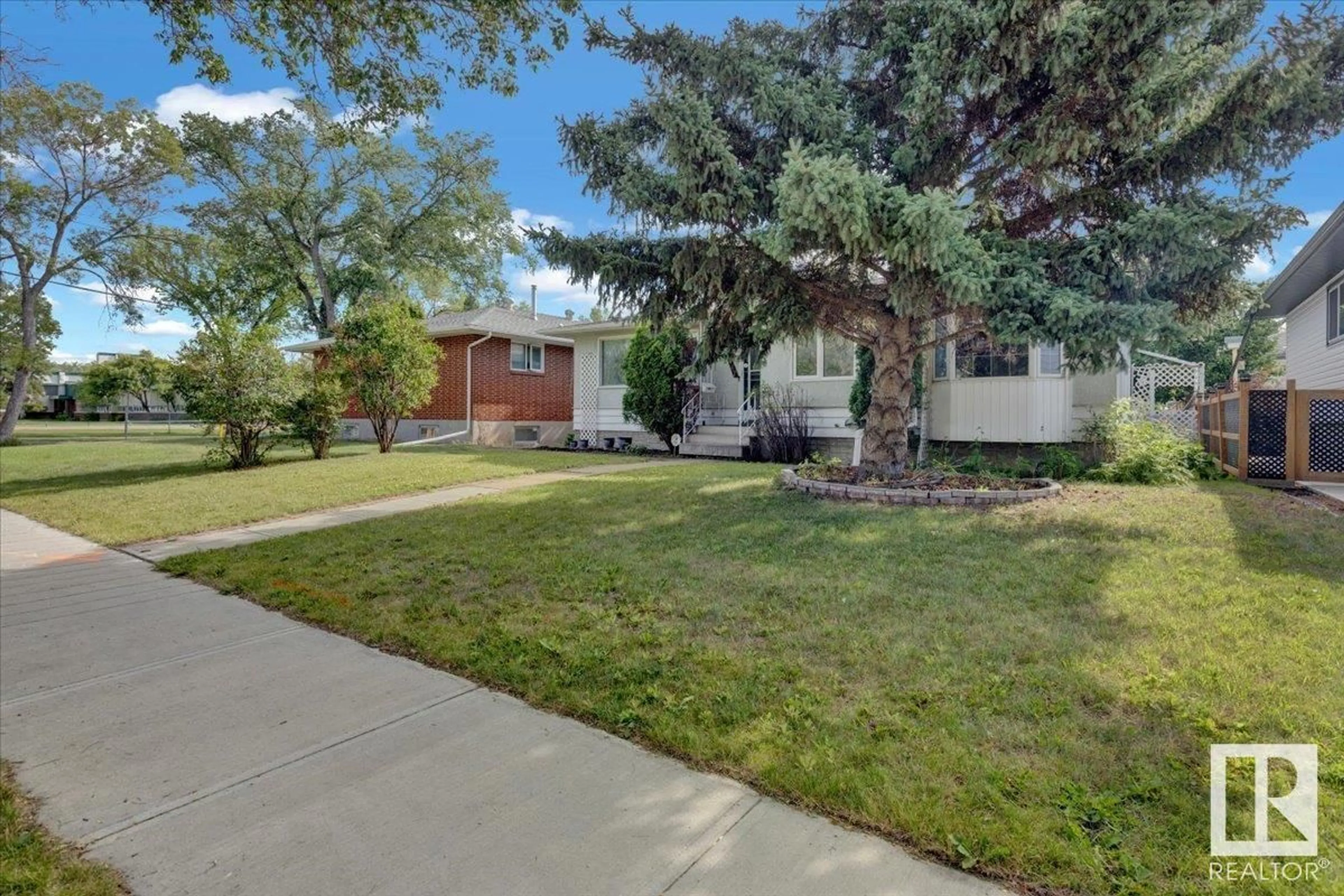 A pic from outside/outdoor area/front of a property/back of a property/a pic from drone, street for NW - 11447 127 ST, Edmonton Alberta T5M0V2