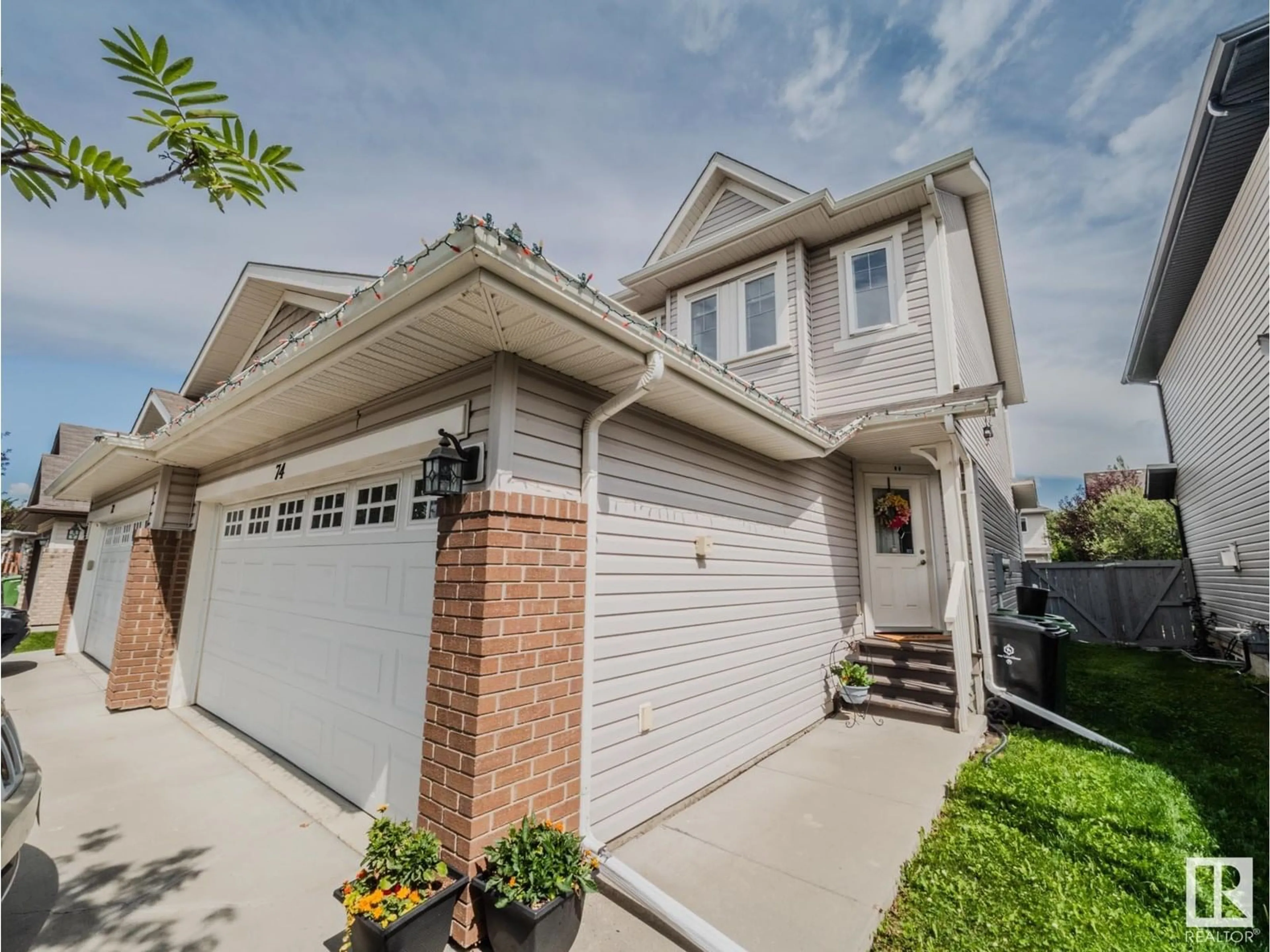 Home with vinyl exterior material, street for 74 RED CANYON WY, Fort Saskatchewan Alberta T8L0E7