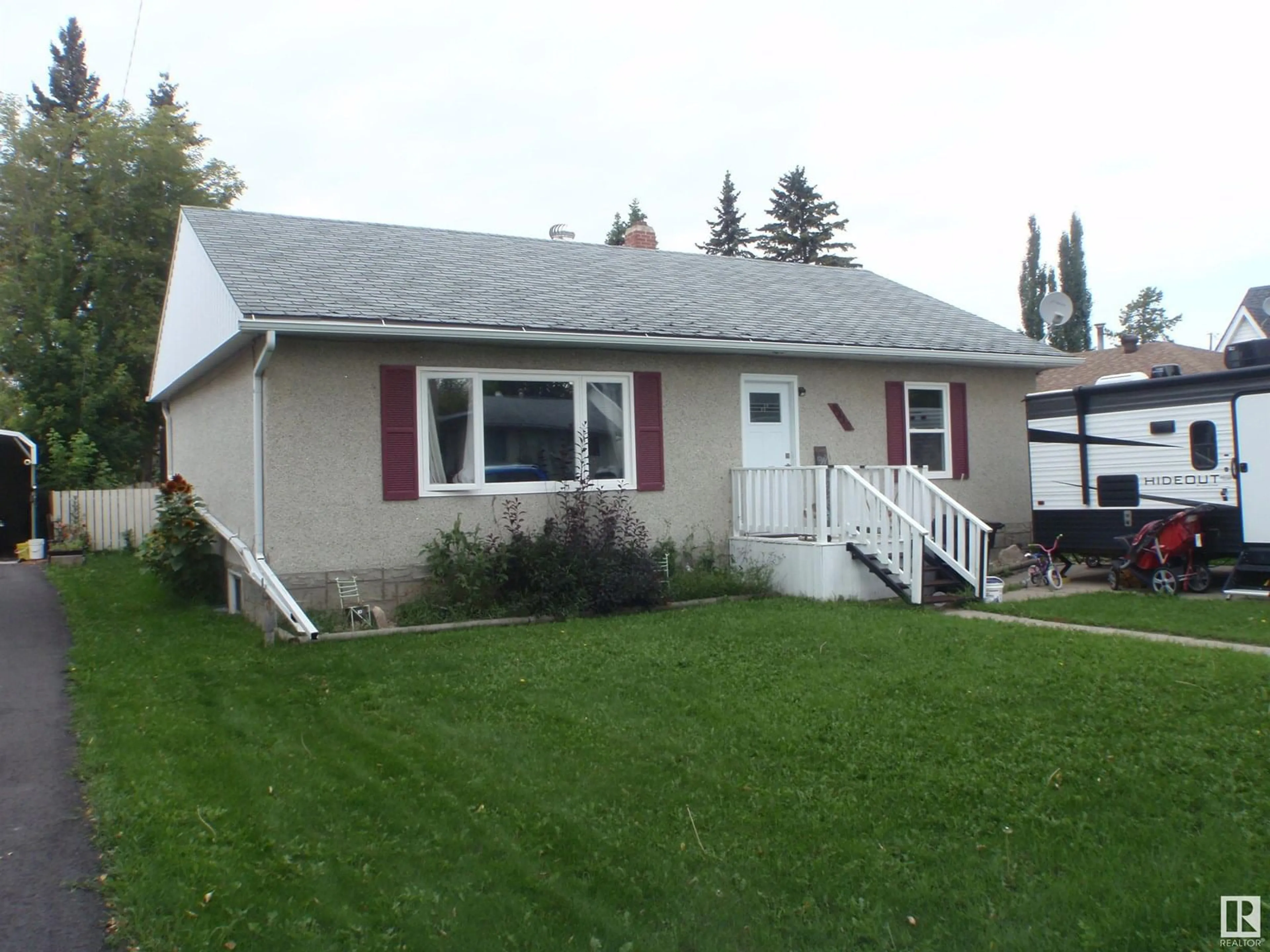 Home with vinyl exterior material, street for 5112 53 ST, Barrhead Alberta T7N1E8