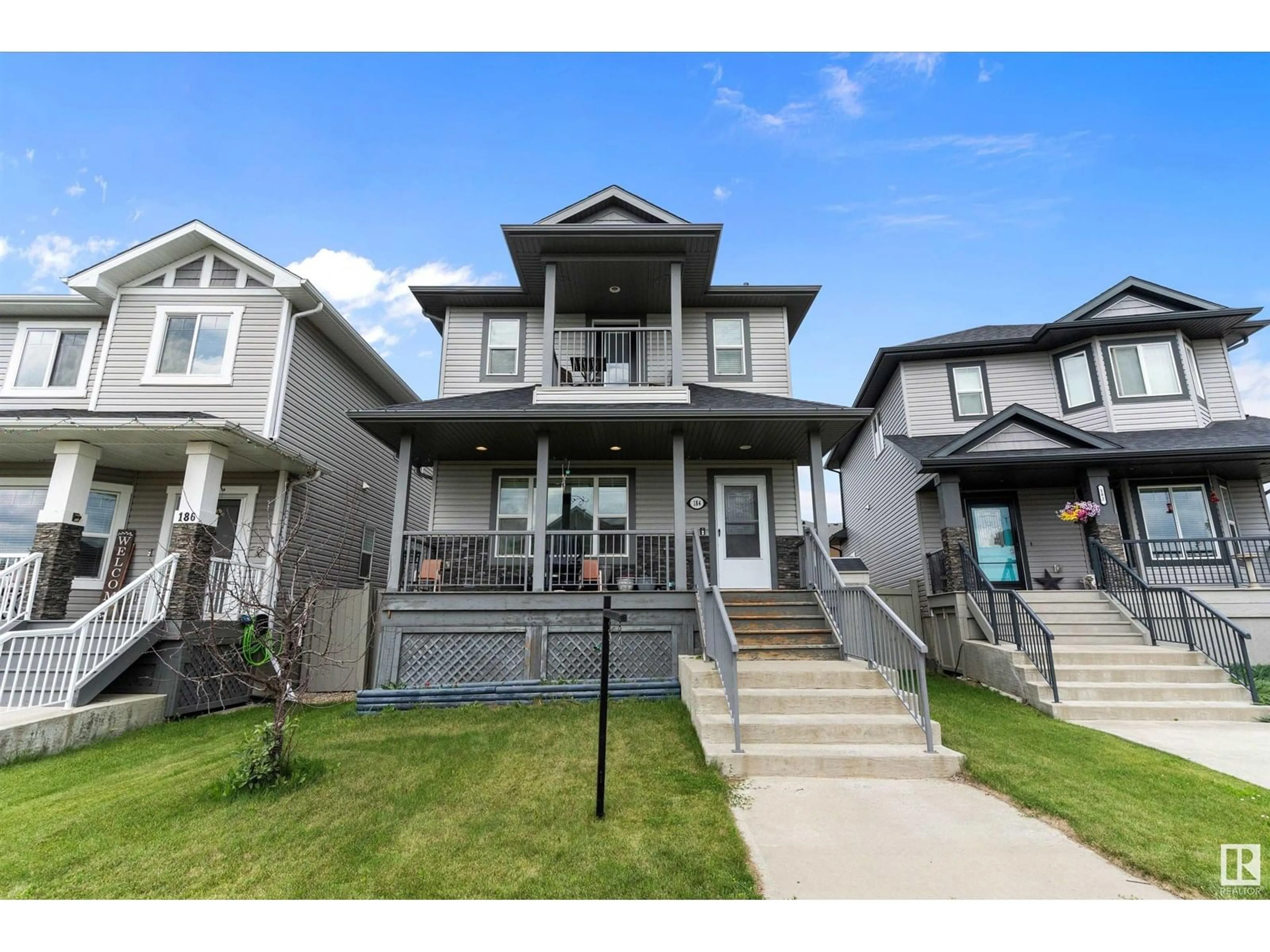 Home with vinyl exterior material, street for 184 ROBINSON DR, Leduc Alberta T9E1B1