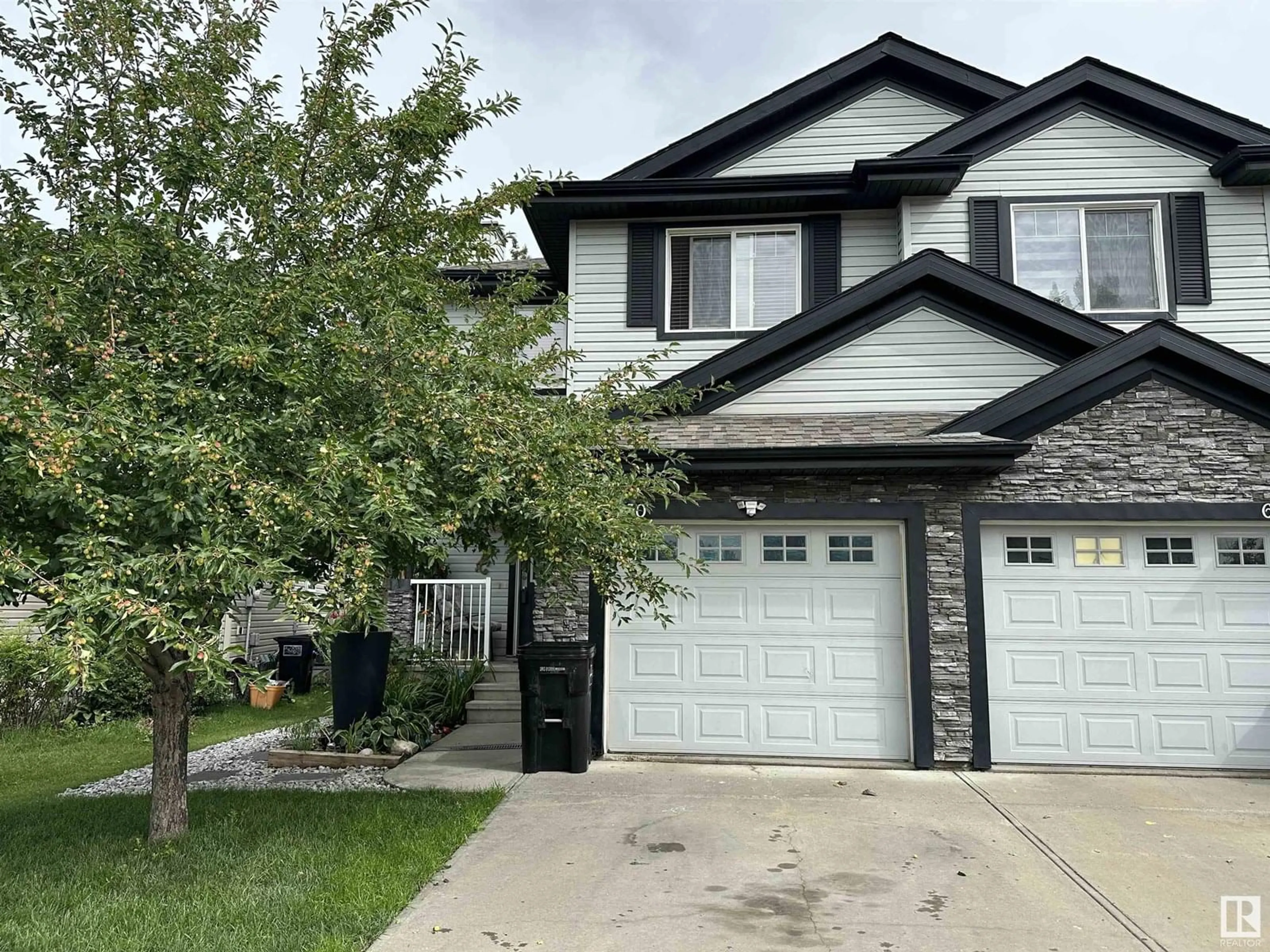 Home with vinyl exterior material, street for 6230 1A AV, Edmonton Alberta T6X0C1
