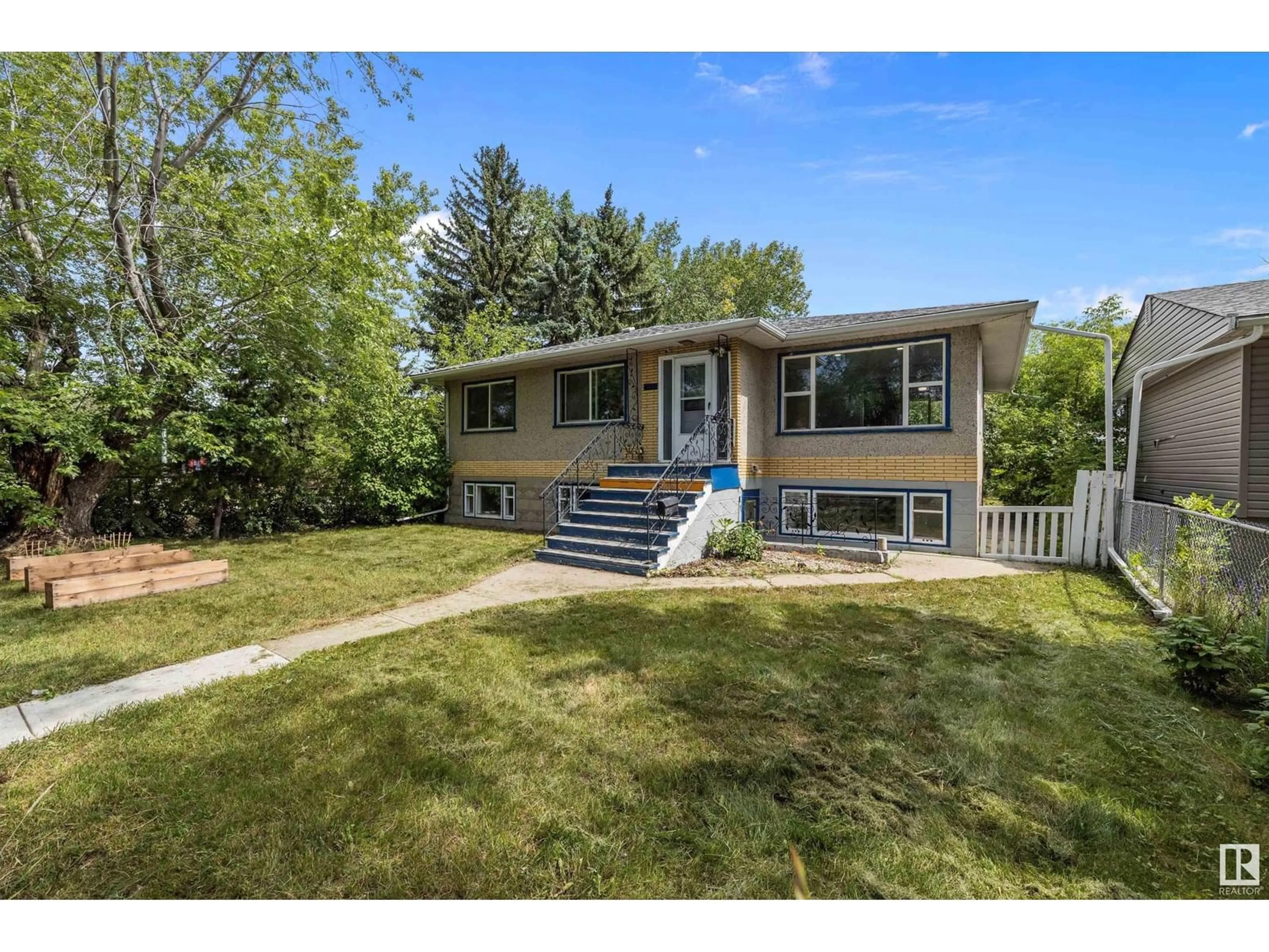 Home with vinyl exterior material, street for 12827 125 ST, Edmonton Alberta T5L0V1