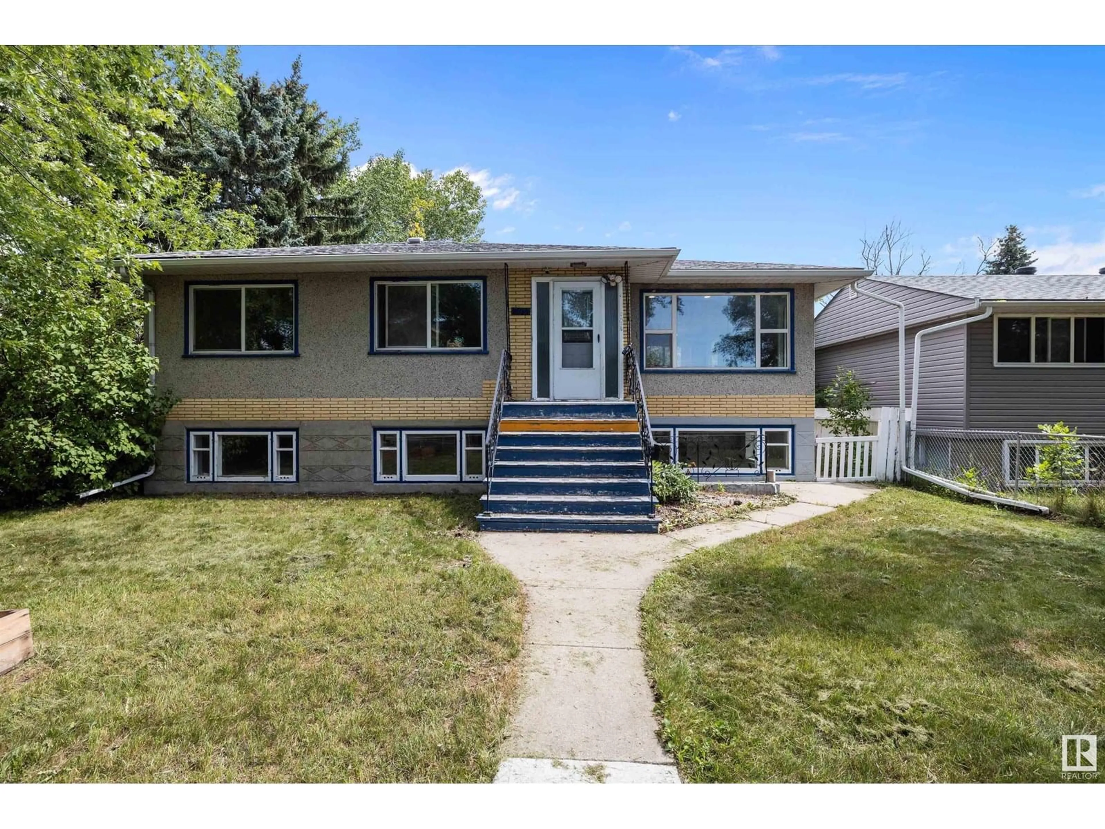 Home with vinyl exterior material, street for 12827 125 ST, Edmonton Alberta T5L0V1