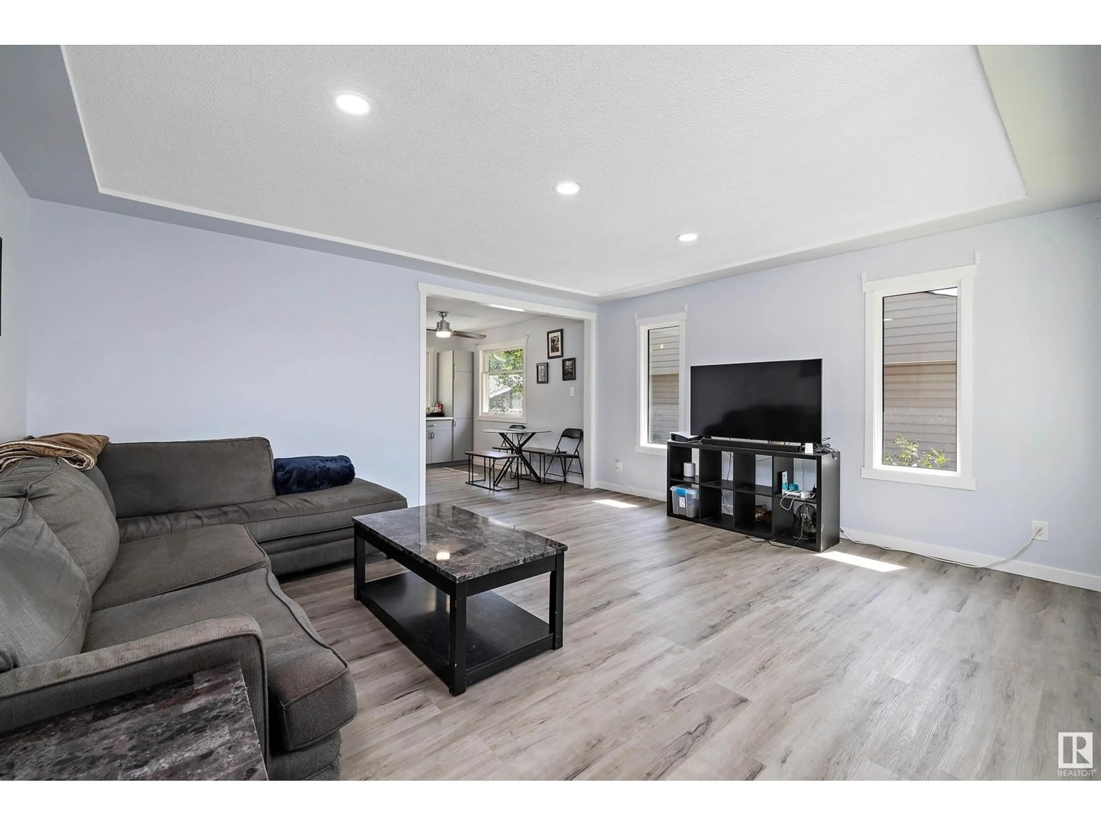 Living room with furniture, wood/laminate floor for 12827 125 ST, Edmonton Alberta T5L0V1