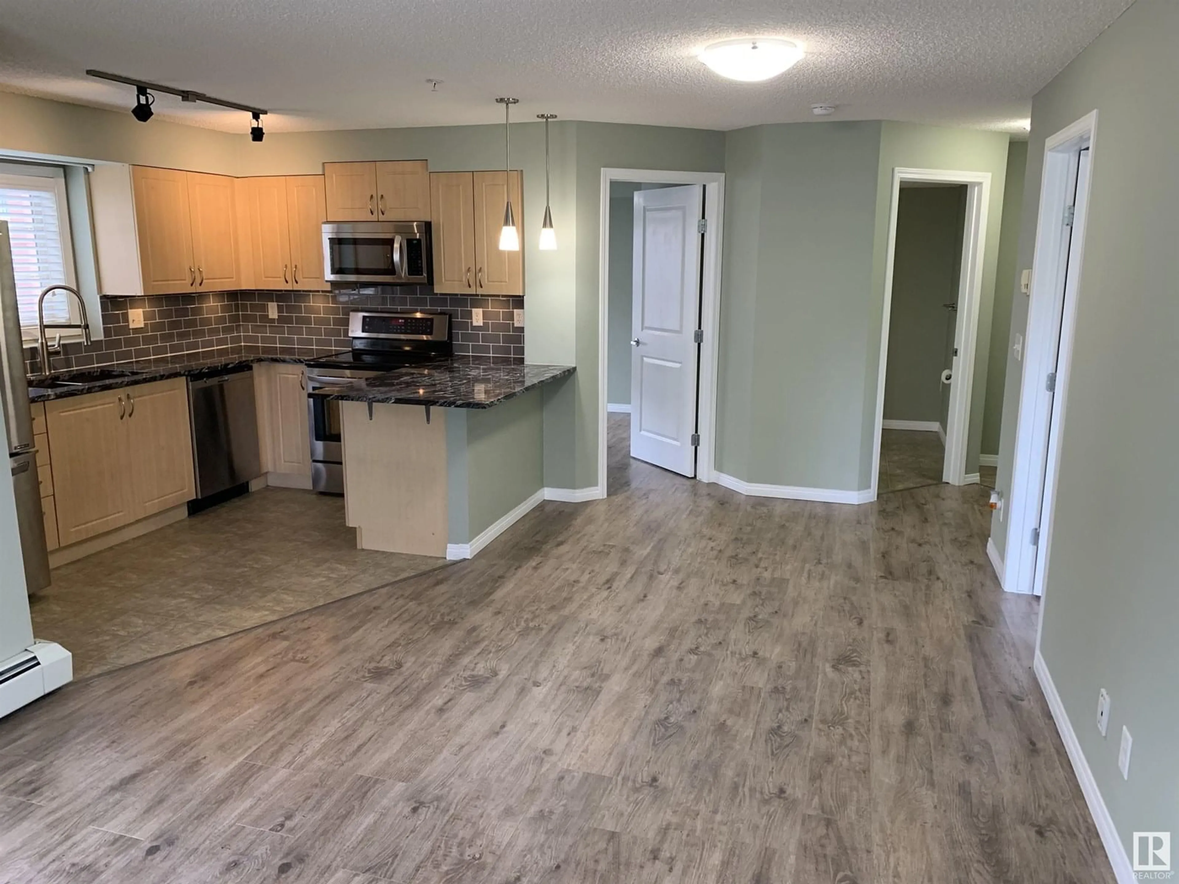 Open concept kitchen, unknown for #201 - 11449 ELLERSLIE RD SW, Edmonton Alberta T6W1T2