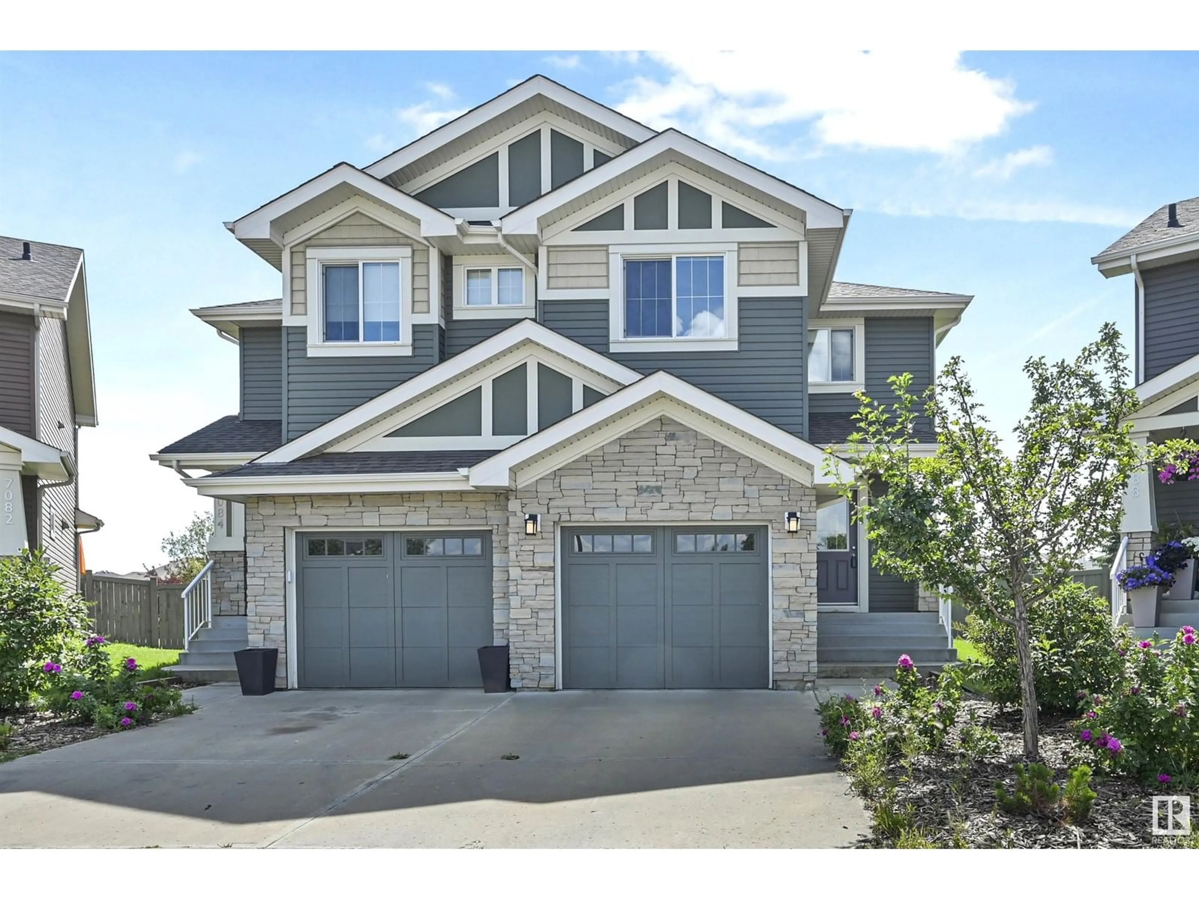 Home with vinyl exterior material, street for 7086 SOUTH TERWILLEGAR DR, Edmonton Alberta T6R0V1