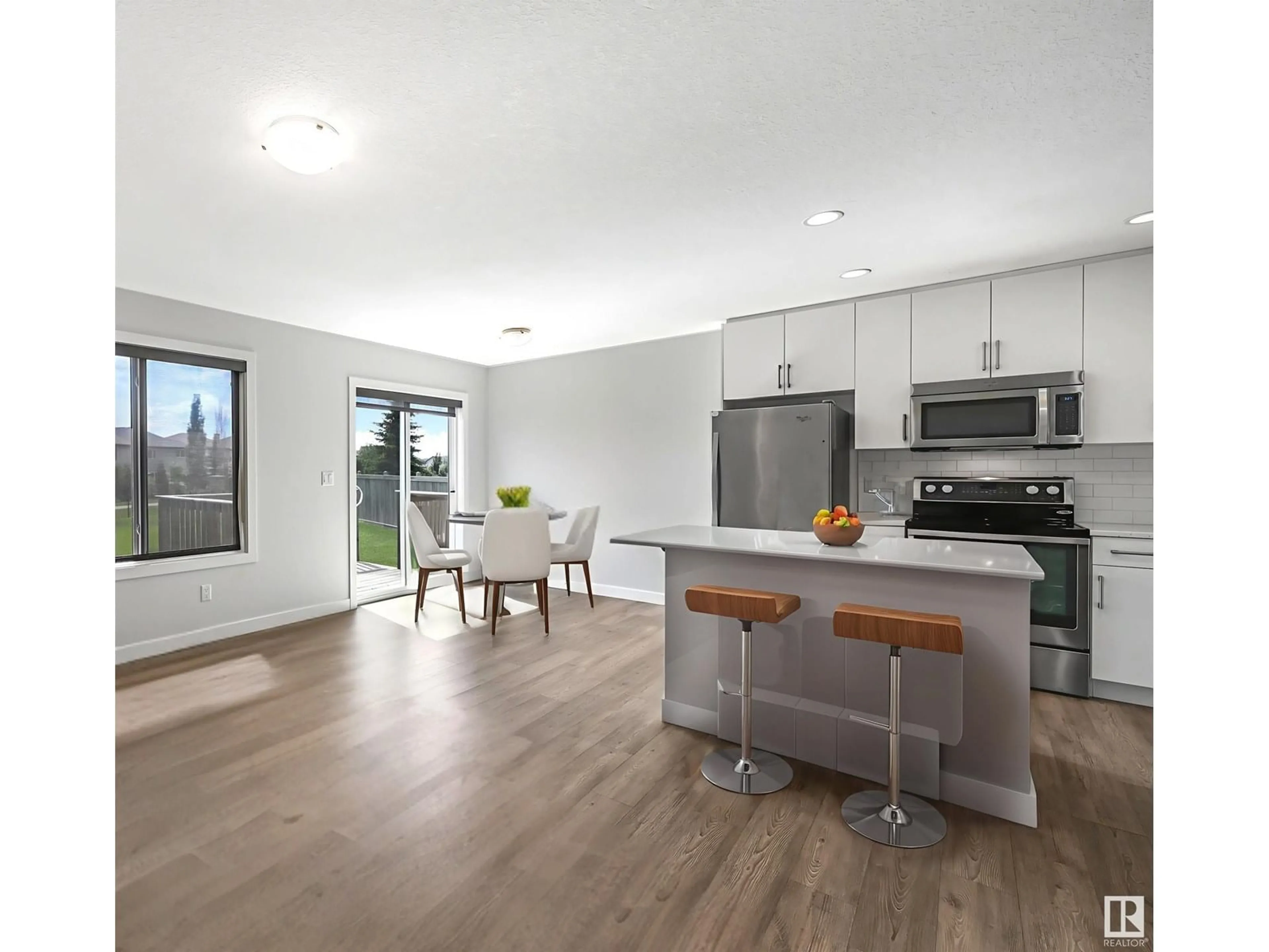 Open concept kitchen, wood/laminate floor for 7086 SOUTH TERWILLEGAR DR, Edmonton Alberta T6R0V1