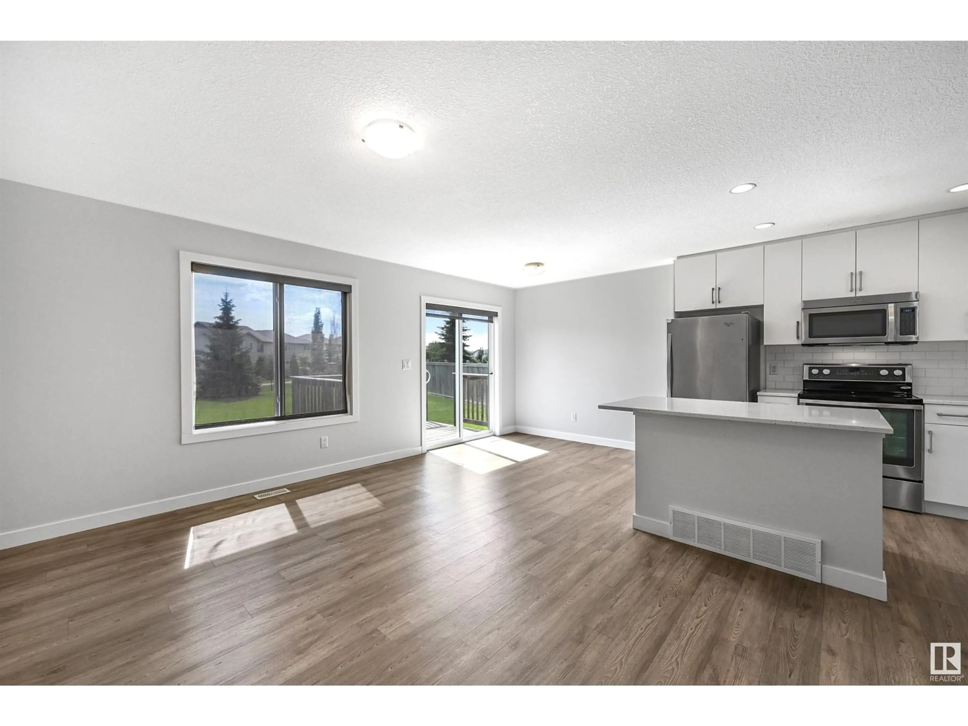 Open concept kitchen, wood/laminate floor for 7086 SOUTH TERWILLEGAR DR, Edmonton Alberta T6R0V1