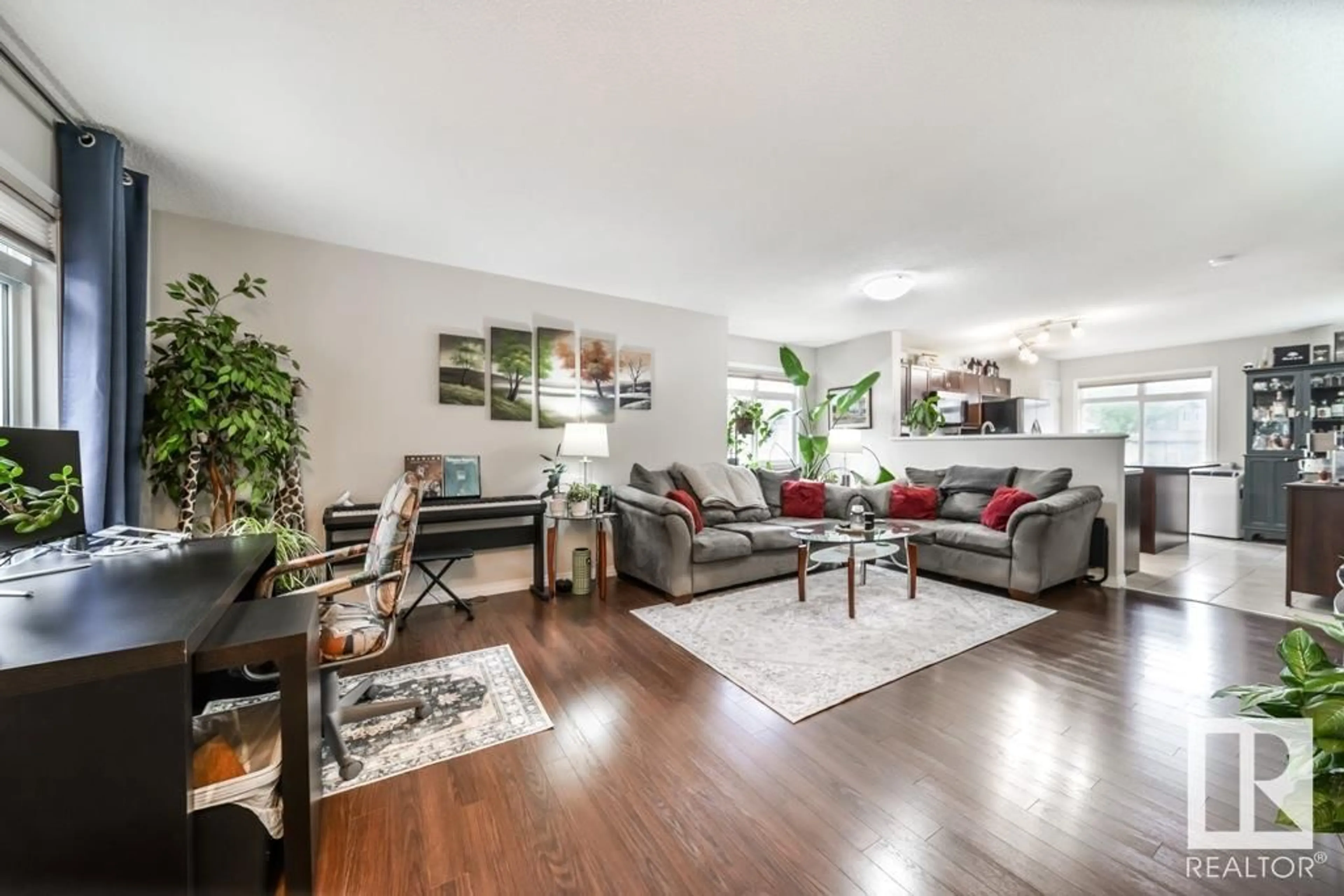 Living room with furniture, wood/laminate floor for 191 1804 70 ST SW, Edmonton Alberta T6X0H4