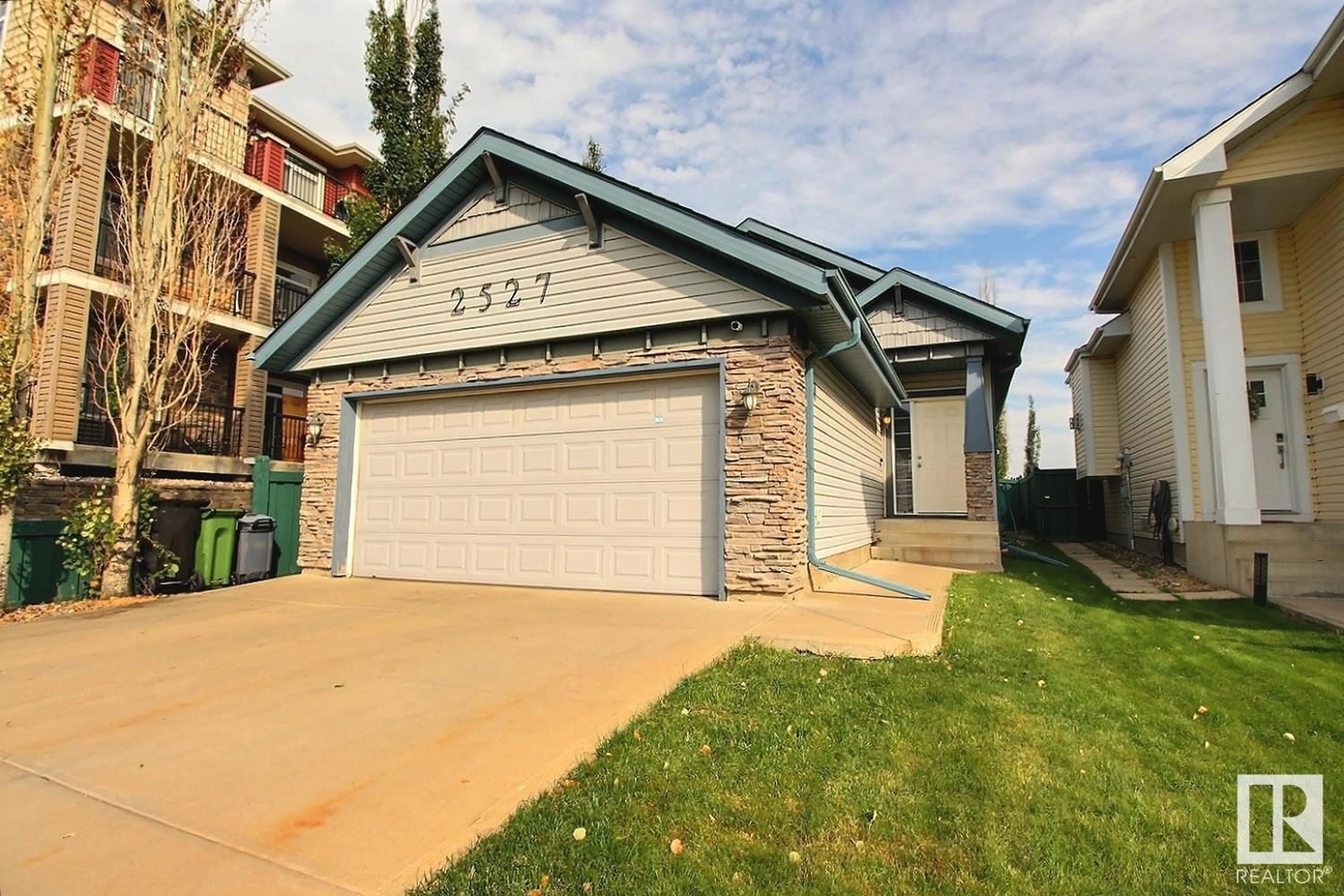 Home with vinyl exterior material, street for 2527 HANNA CR, Edmonton Alberta T6R3P7
