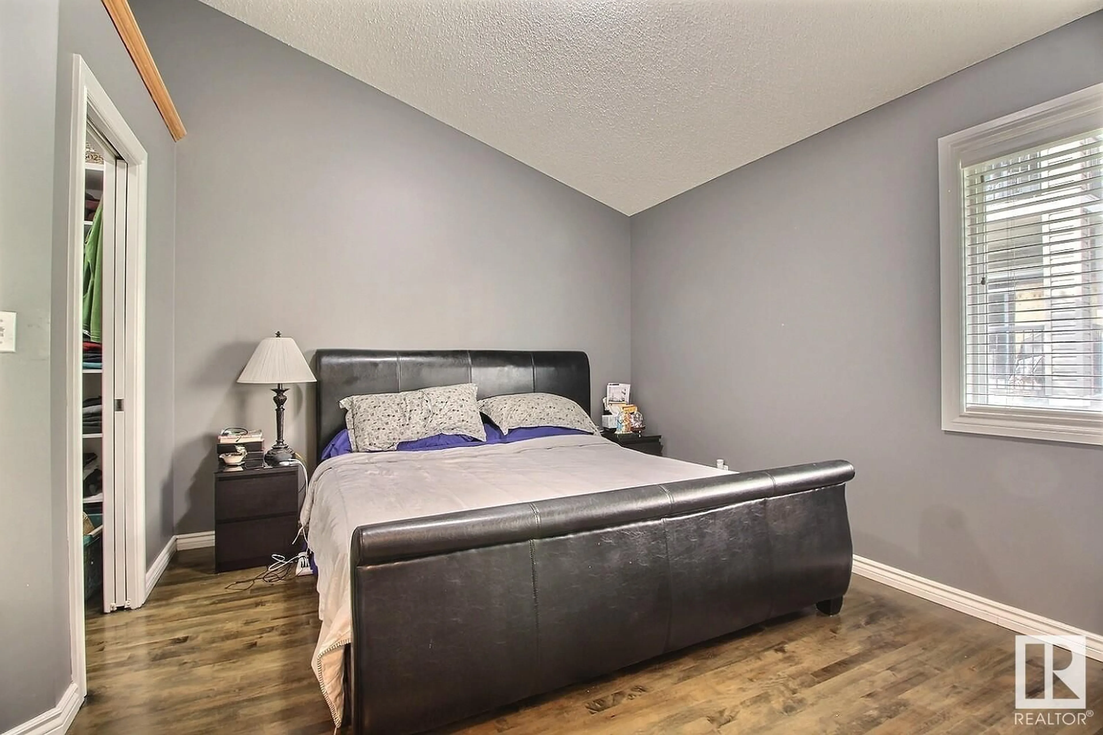 Bedroom with bed, wood/laminate floor for 2527 HANNA CR, Edmonton Alberta T6R3P7