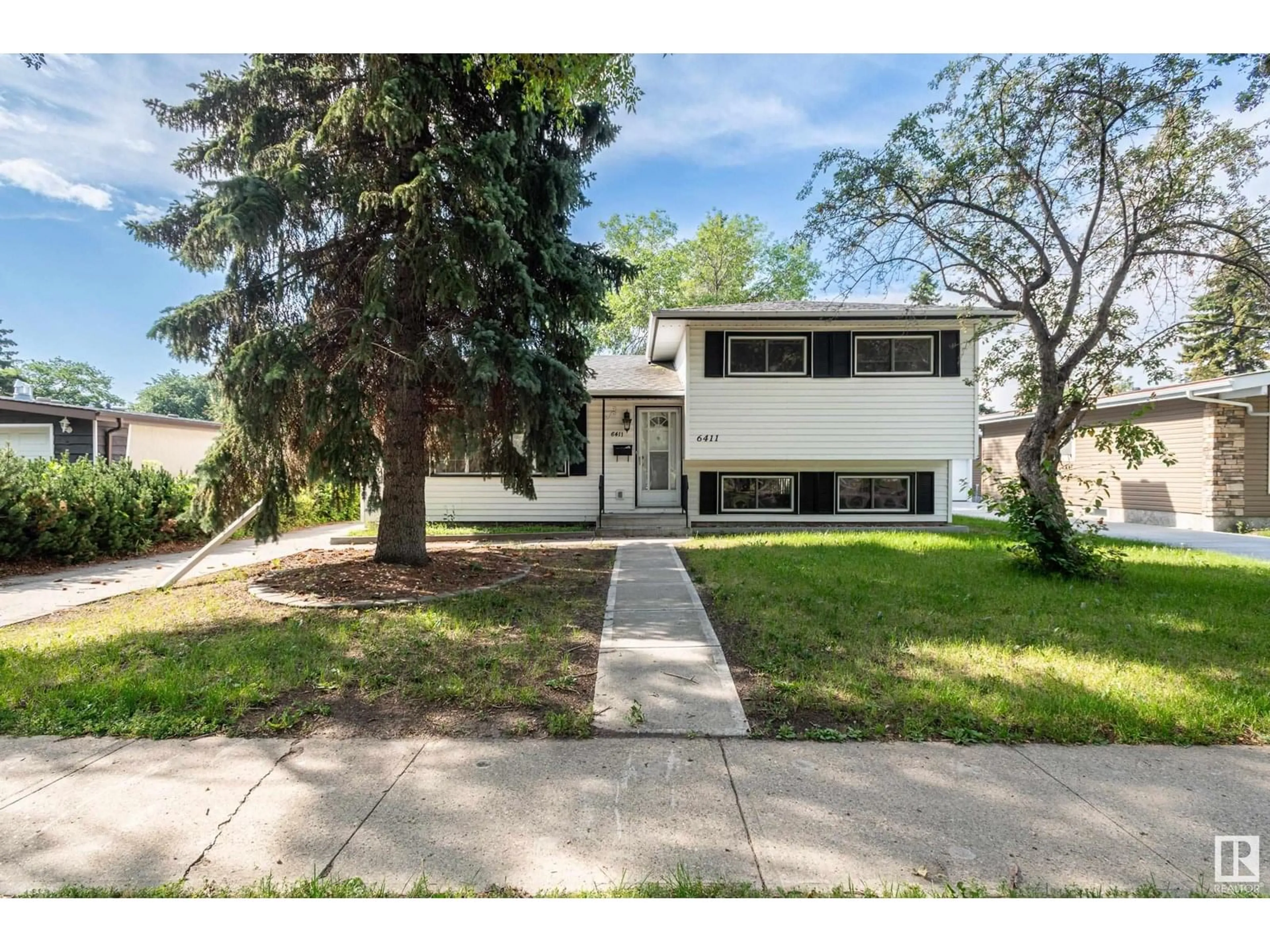 Home with vinyl exterior material, street for 6411 149 AV, Edmonton Alberta T5A1W1