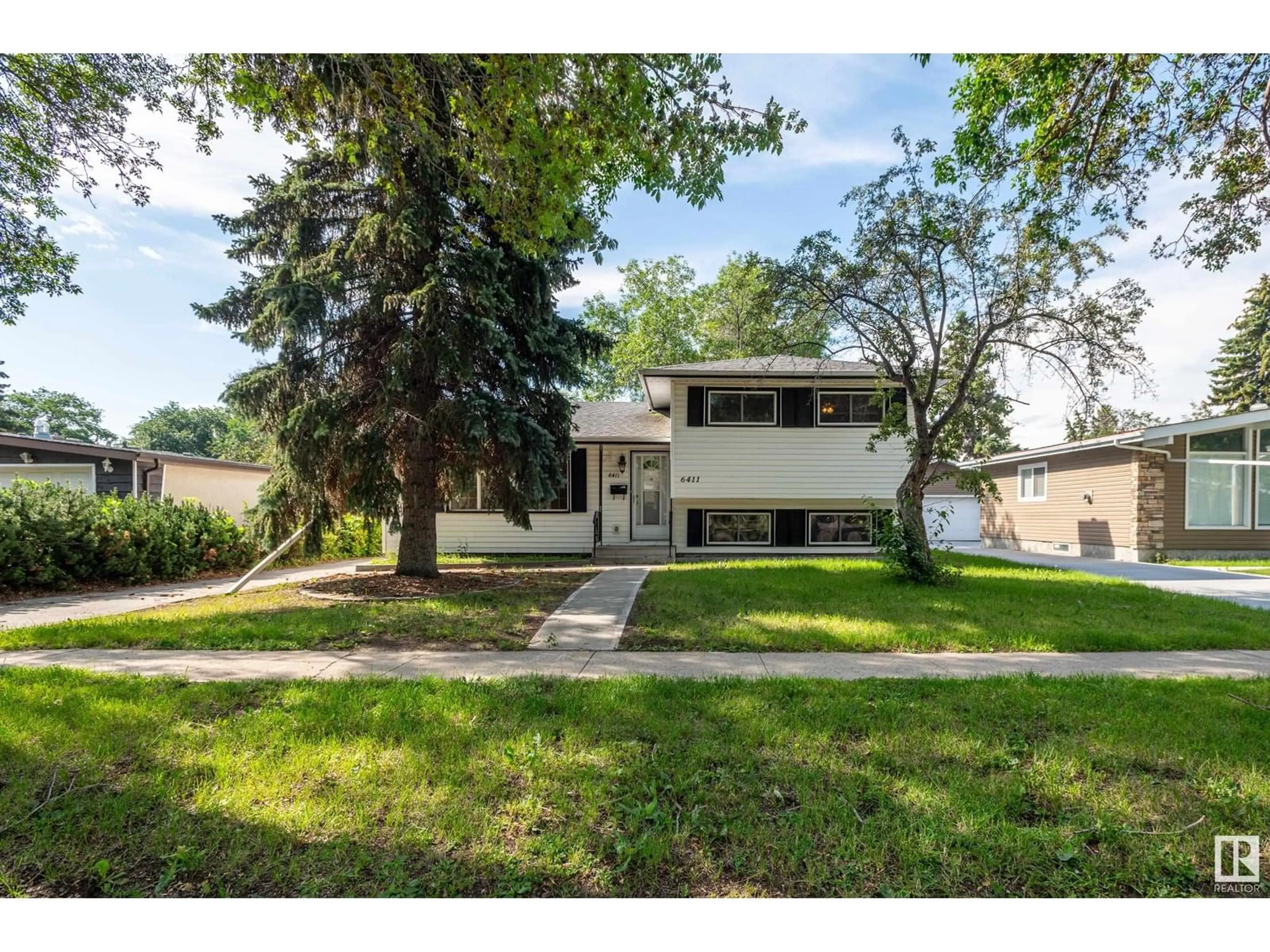 Home with vinyl exterior material, street for 6411 149 AV, Edmonton Alberta T5A1W1