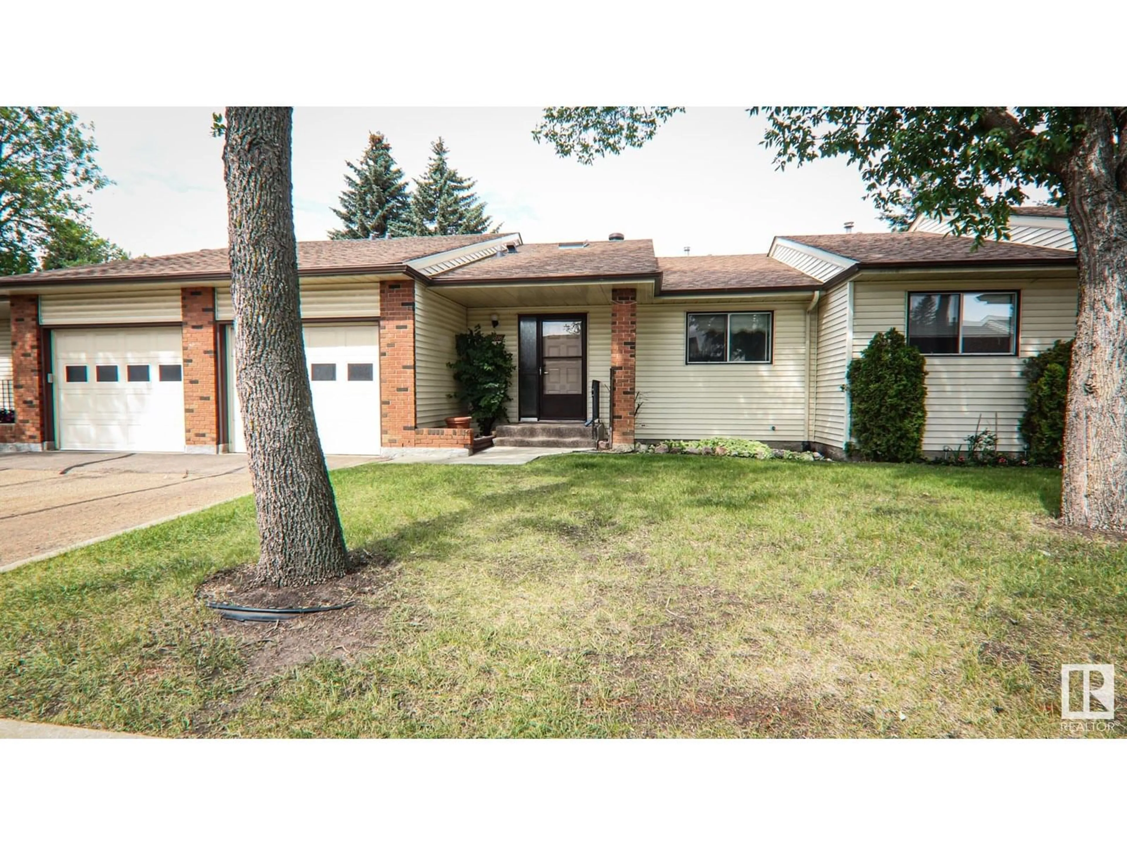 Home with vinyl exterior material, street for 10816 11 AV, Edmonton Alberta T6J6J1