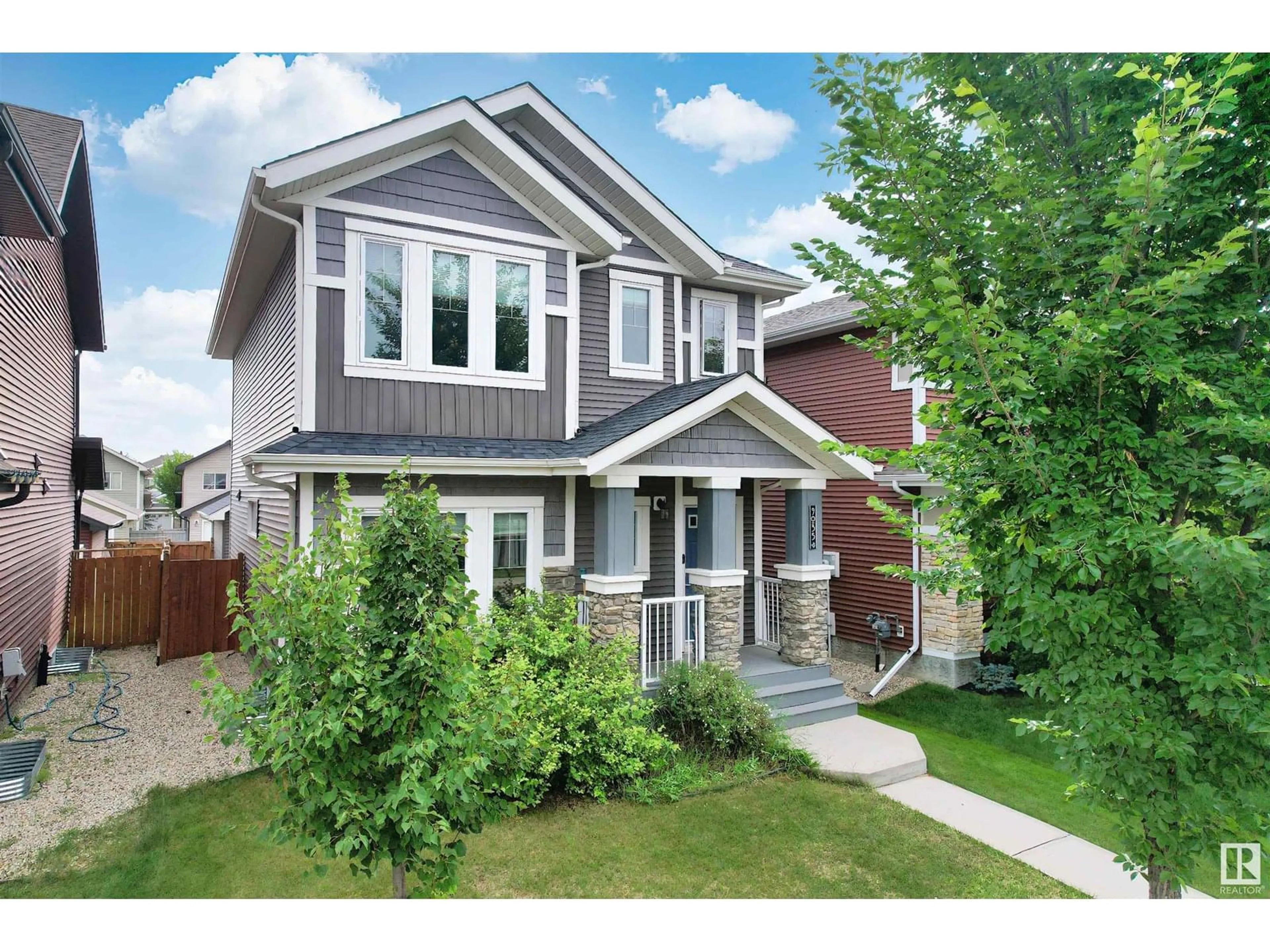 Home with vinyl exterior material, street for NW - 9035 219 ST, Edmonton Alberta T5T6Z8
