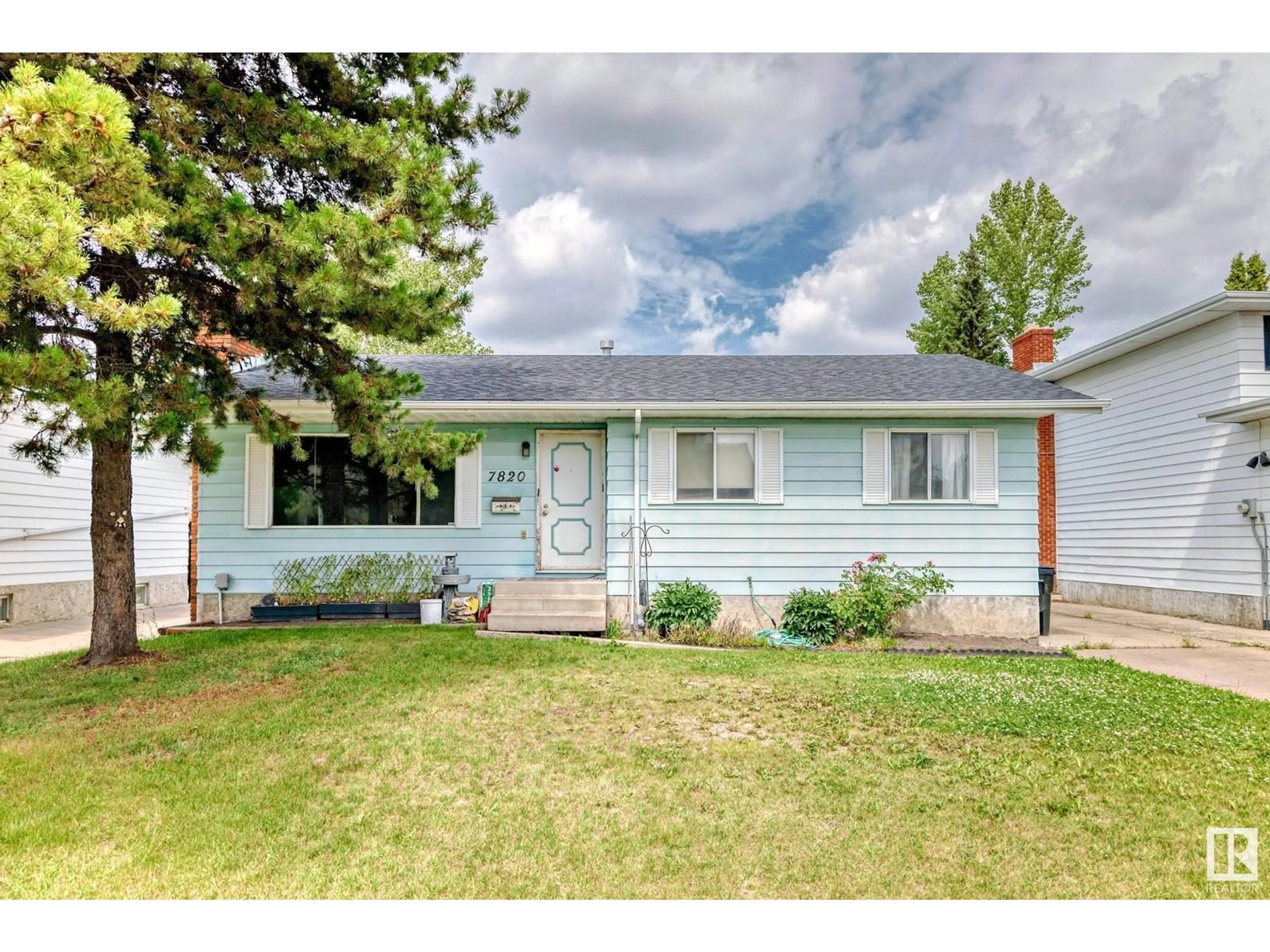 Home with vinyl exterior material, street for 7820 22 ST, Edmonton Alberta T6K2E3