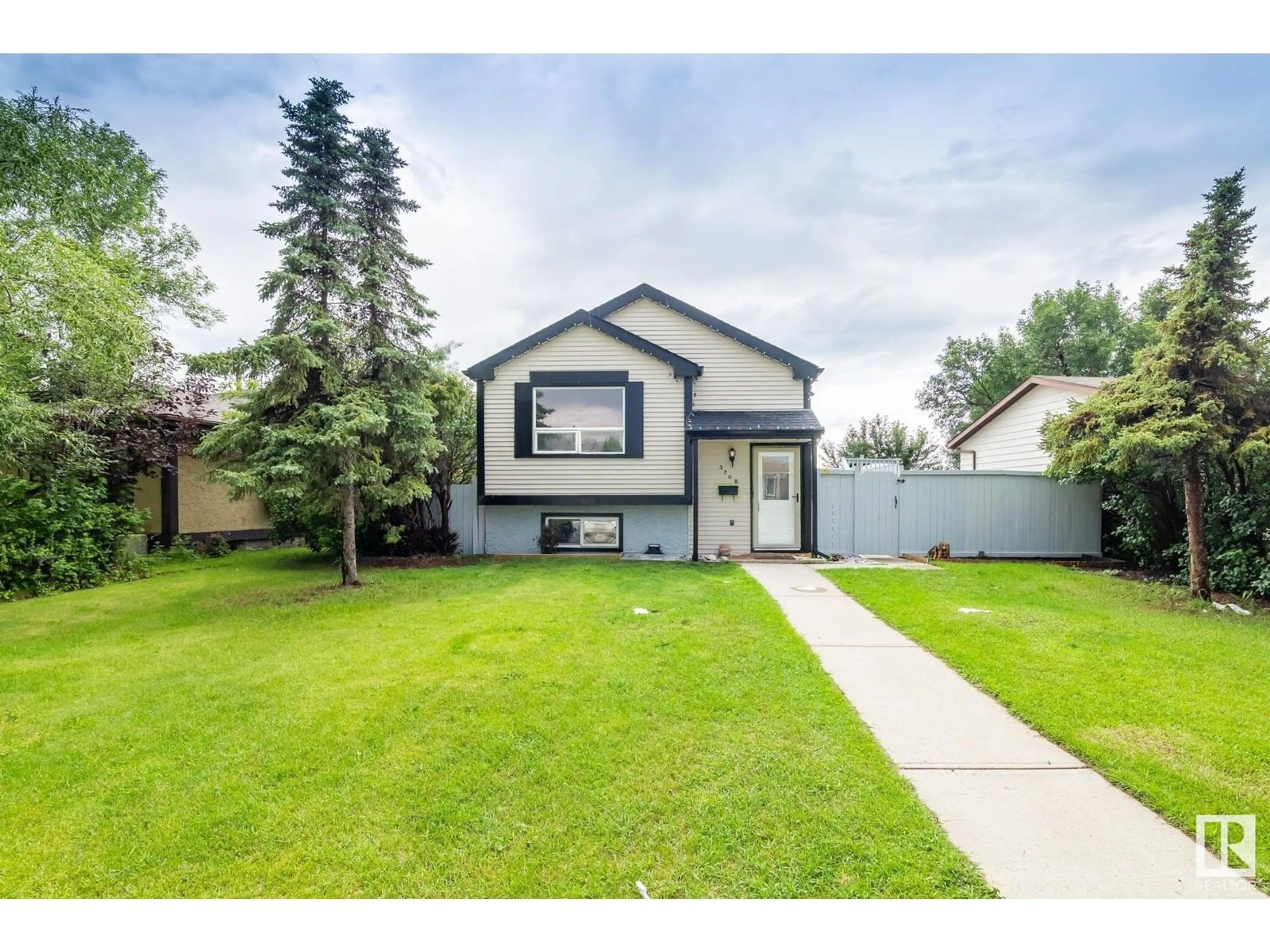 Home with vinyl exterior material, street for 3708 12 AV, Edmonton Alberta T6L3B2