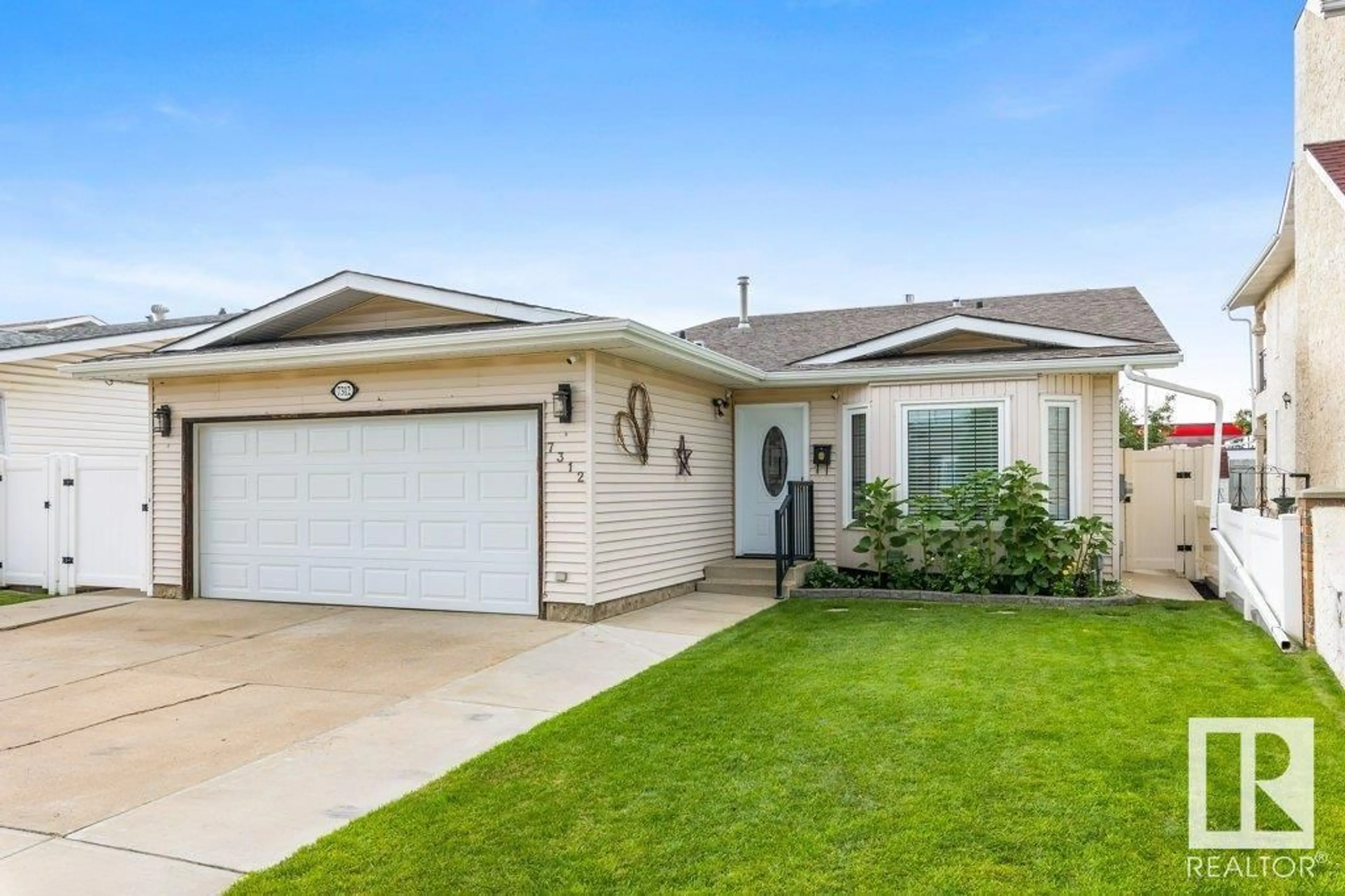 Home with vinyl exterior material, street for NW - 7312 152C AV, Edmonton Alberta T5C3M8