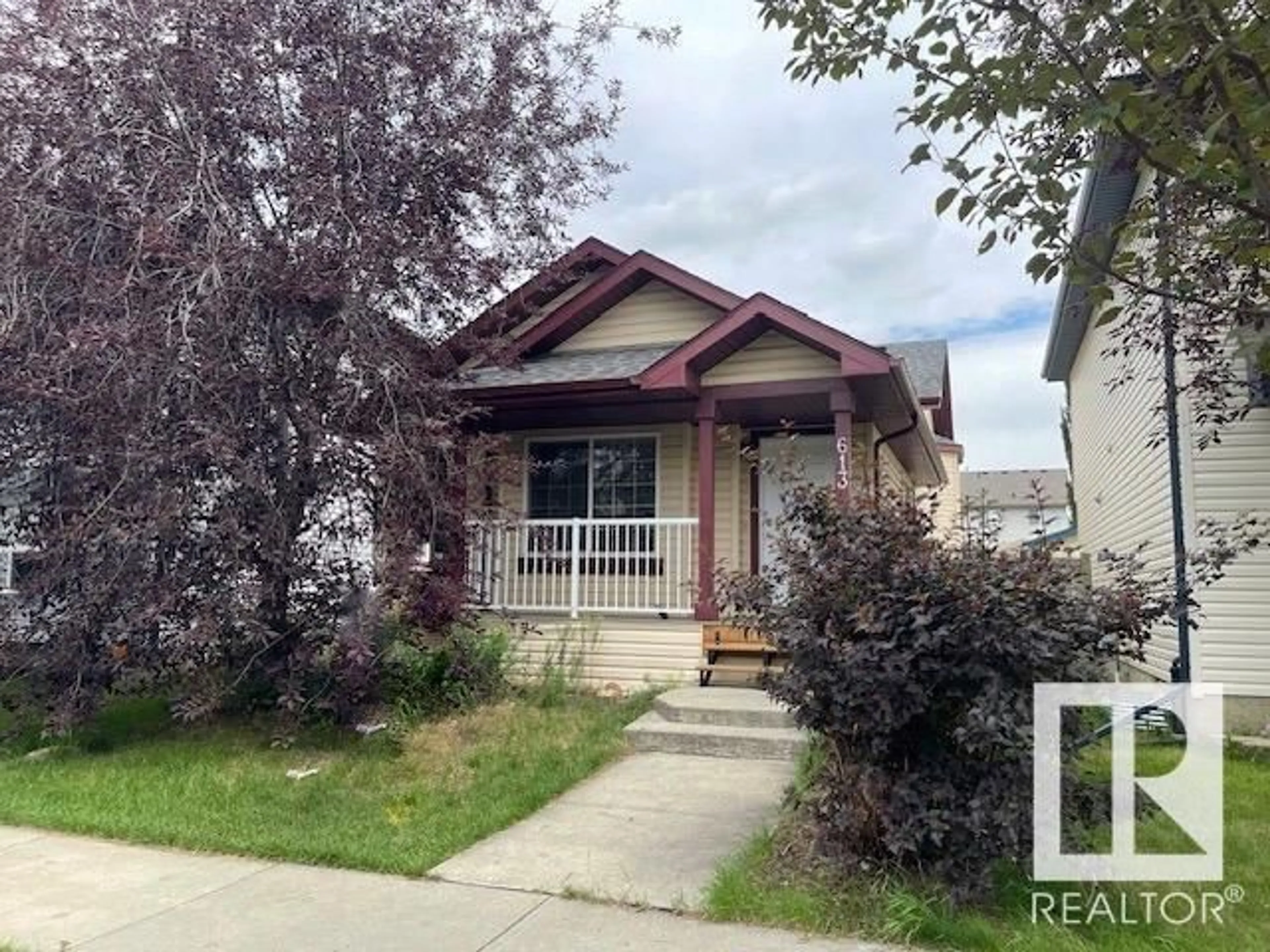 Home with vinyl exterior material, street for 613 83 ST, Edmonton Alberta T6X1L6