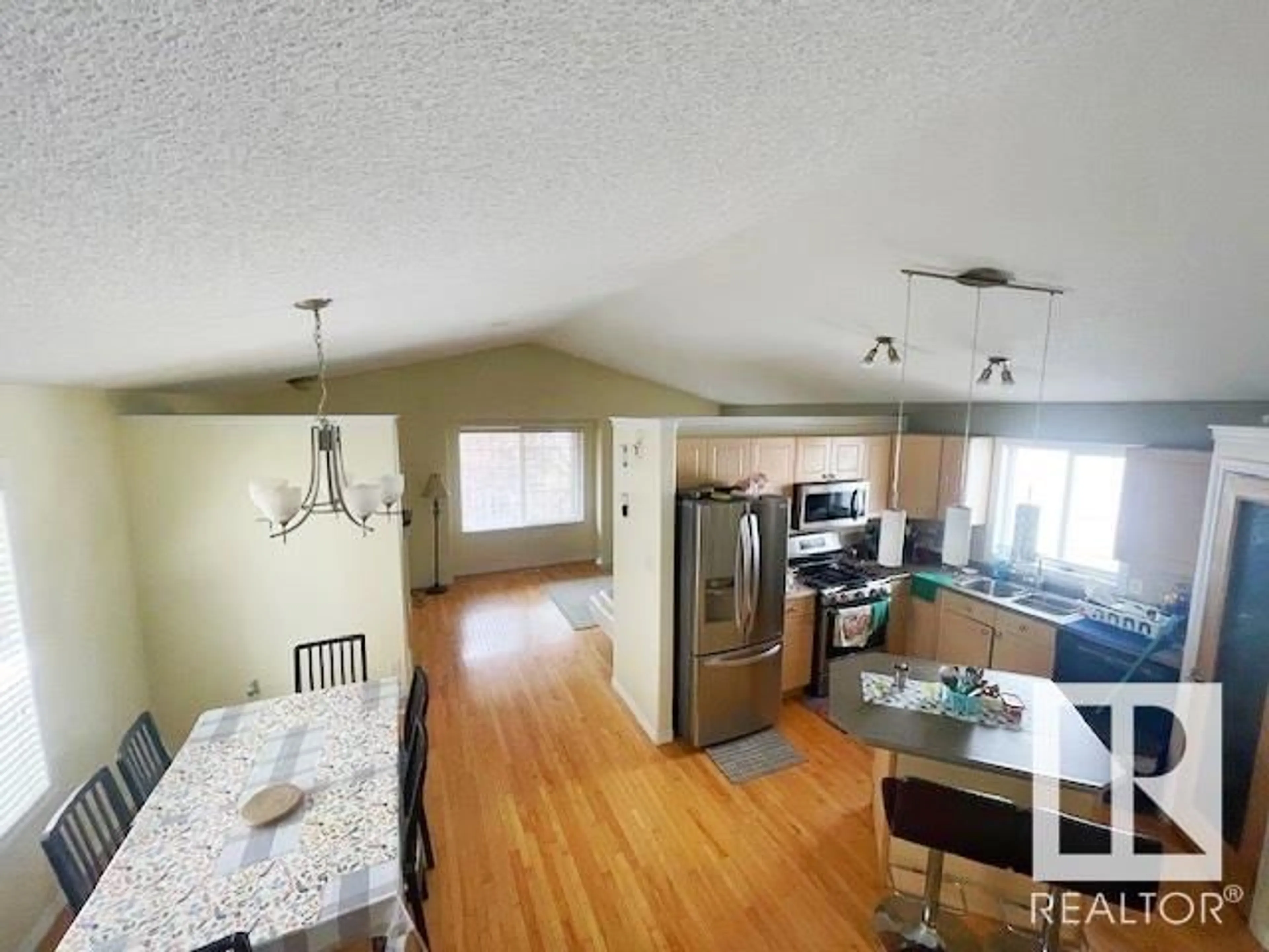 Open concept kitchen, wood/laminate floor for 613 83 ST, Edmonton Alberta T6X1L6
