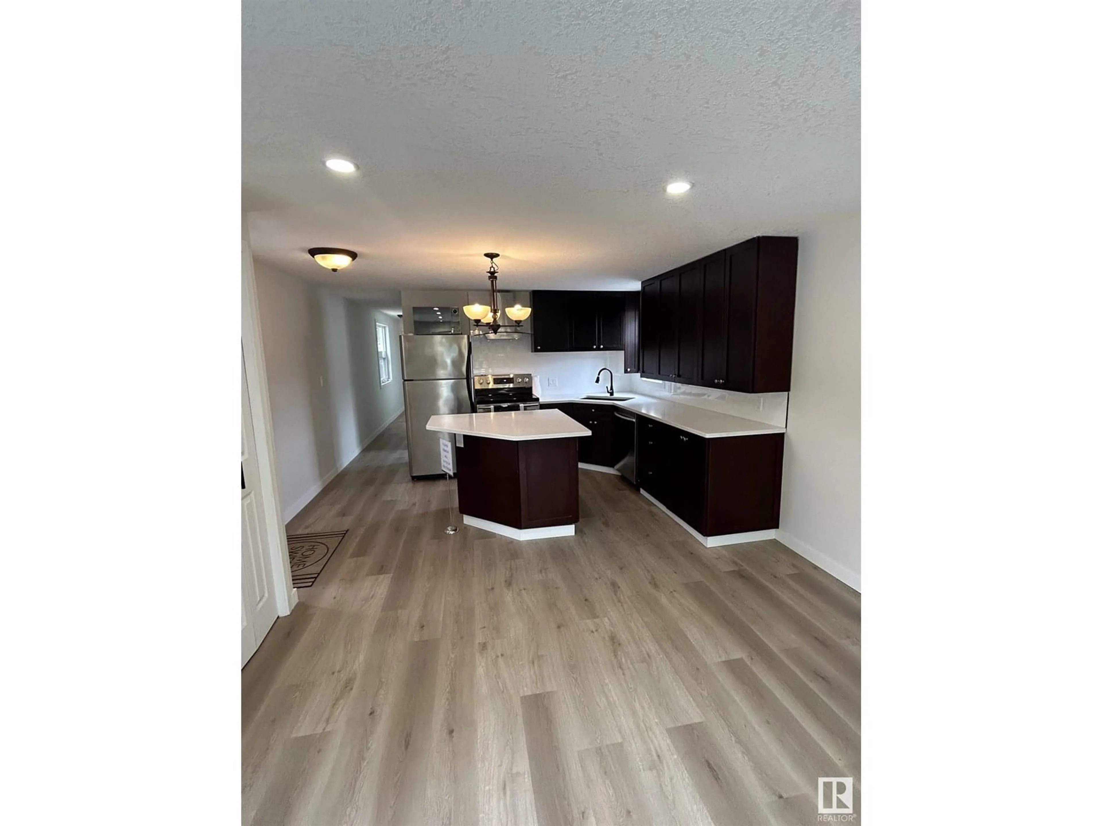 Open concept kitchen, wood/laminate floor for NW - 714 WEST RIDGE PL, Edmonton Alberta T5S1T5