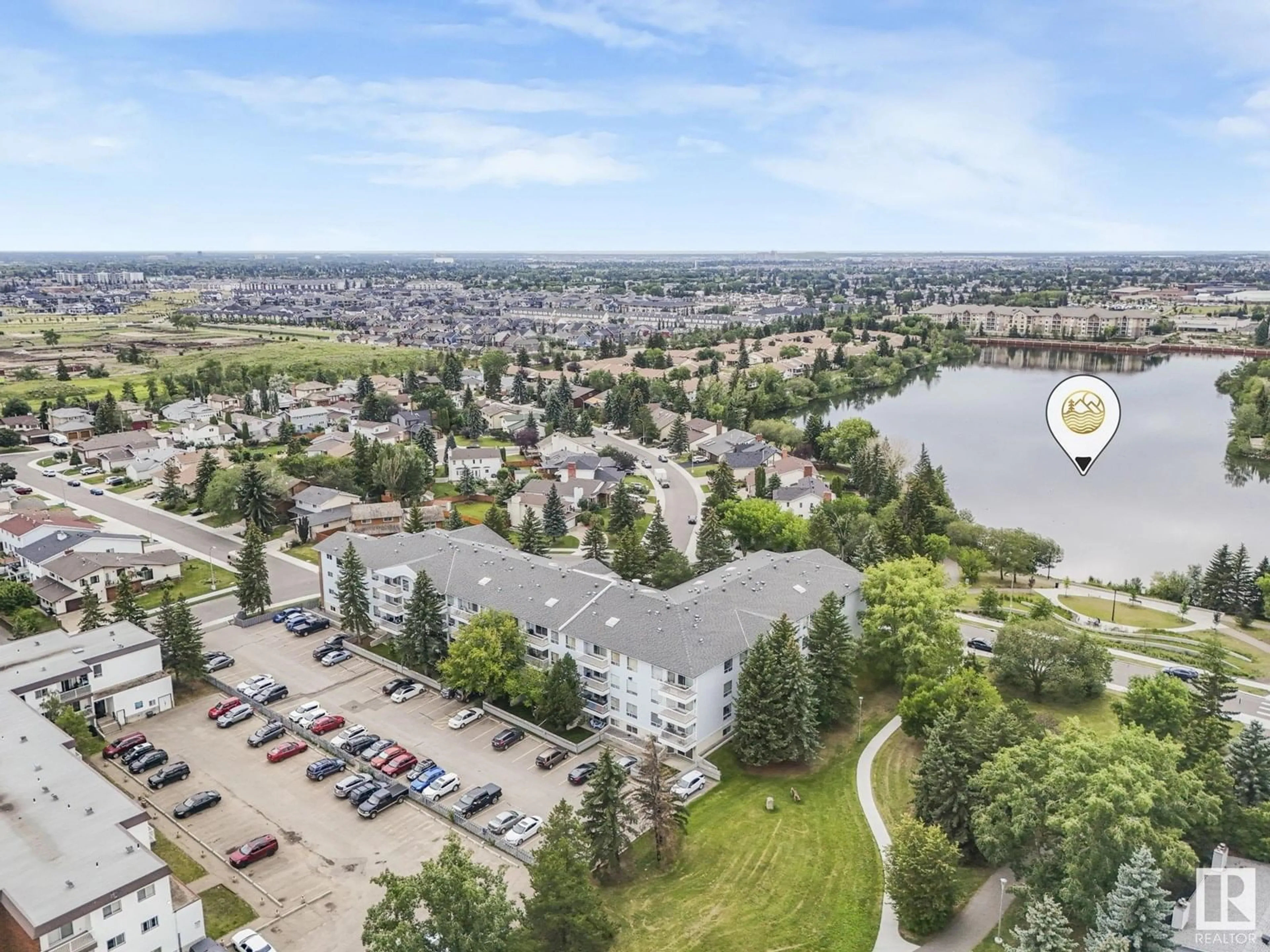 A pic from outside/outdoor area/front of a property/back of a property/a pic from drone, mountain view for #116 - 15503 106 ST NW, Edmonton Alberta T5X5W7