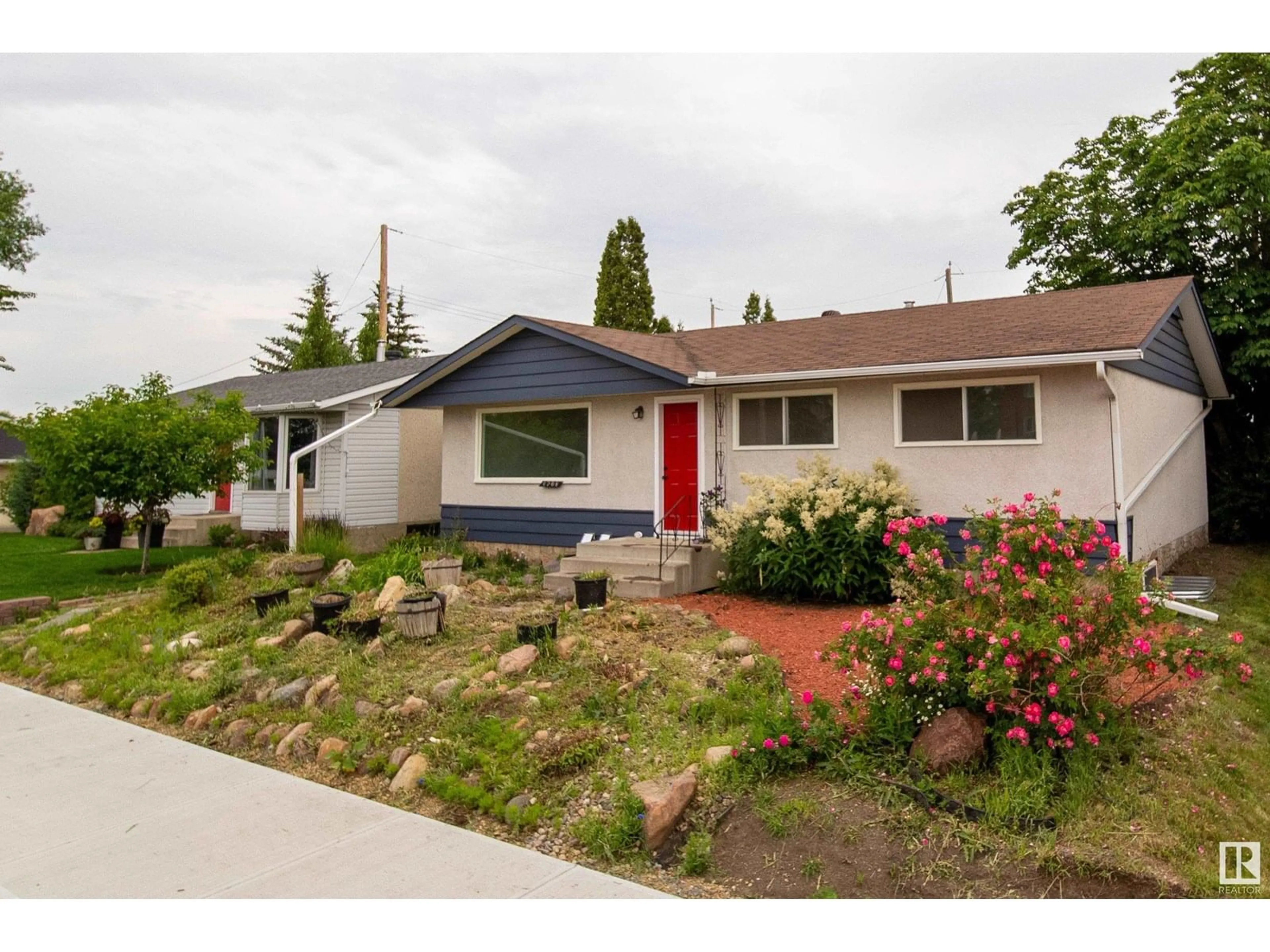 Home with vinyl exterior material, street for 6708 132 AV, Edmonton Alberta T5C2A5