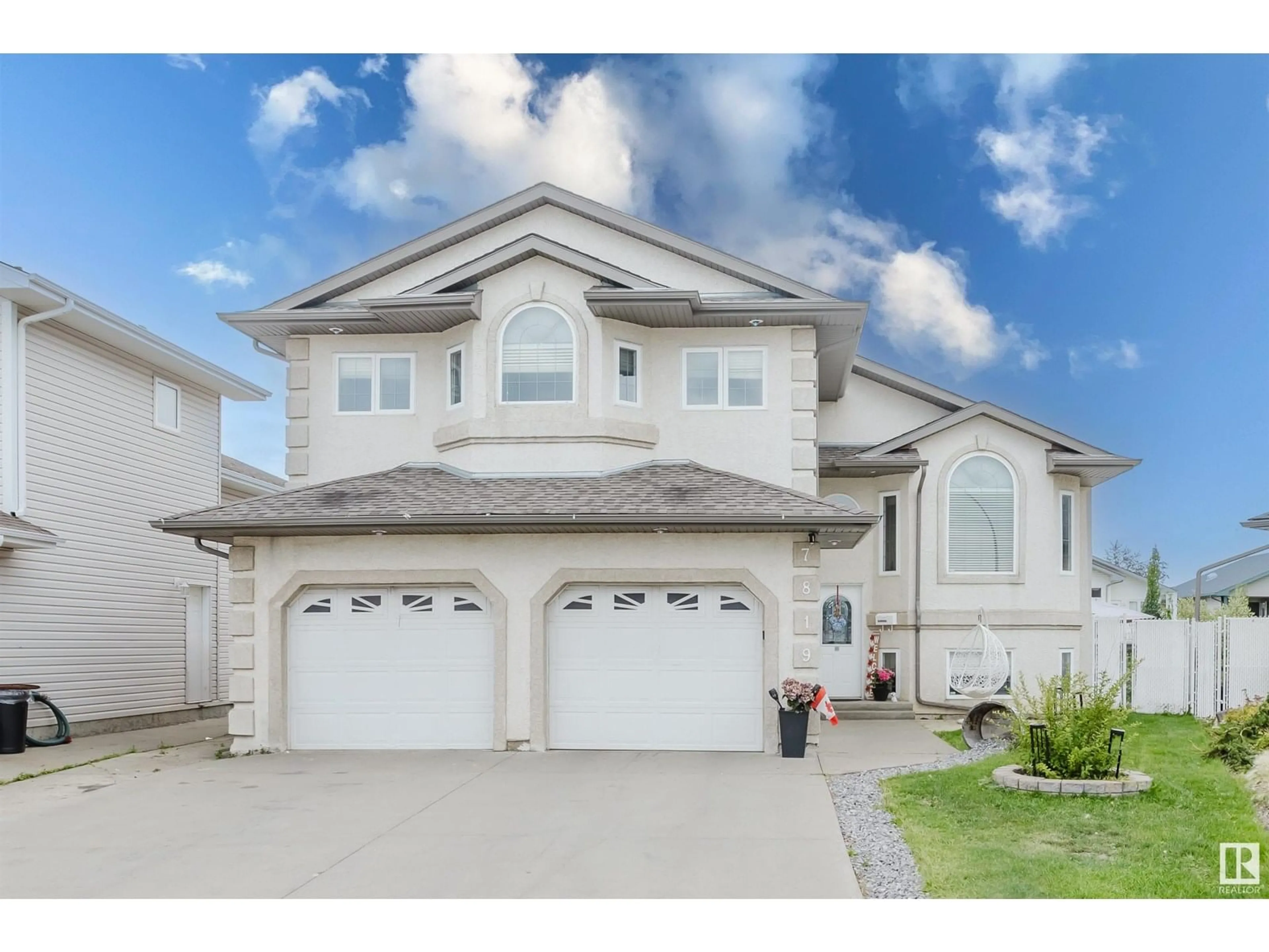 Home with vinyl exterior material, street for 7819 166 AV, Edmonton Alberta T5Z3V8