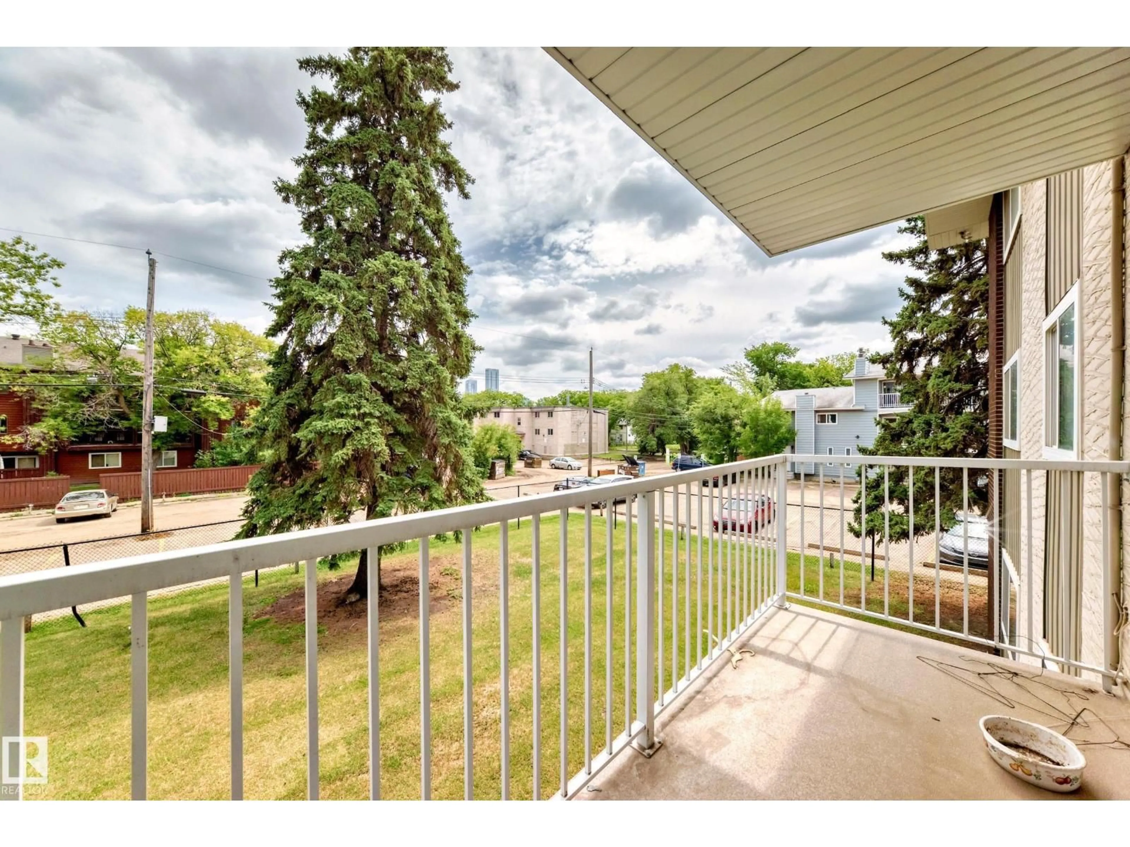 Patio, city buildings view from balcony for 202 - 10835 114 ST, Edmonton Alberta T5H3K3