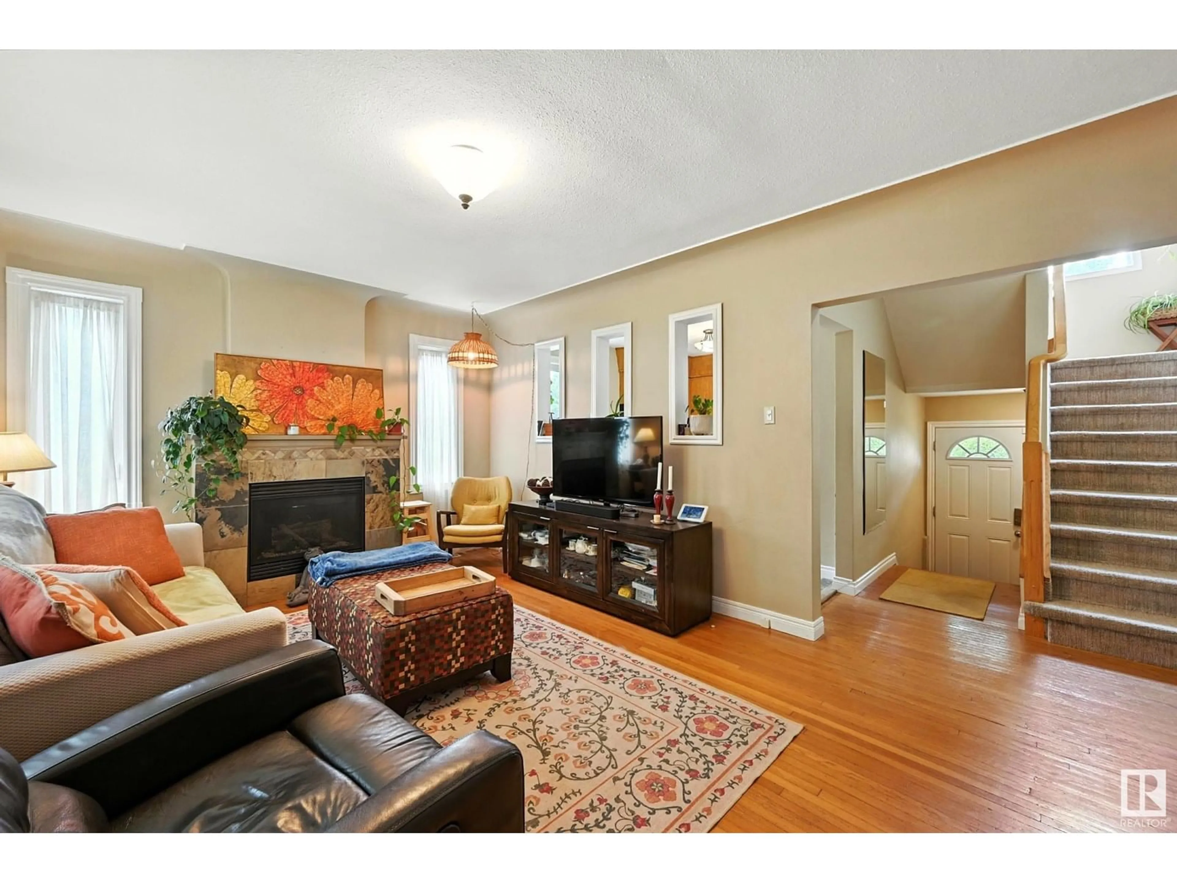 Living room with furniture, wood/laminate floor for 11322 60 ST, Edmonton Alberta T5W3Z1