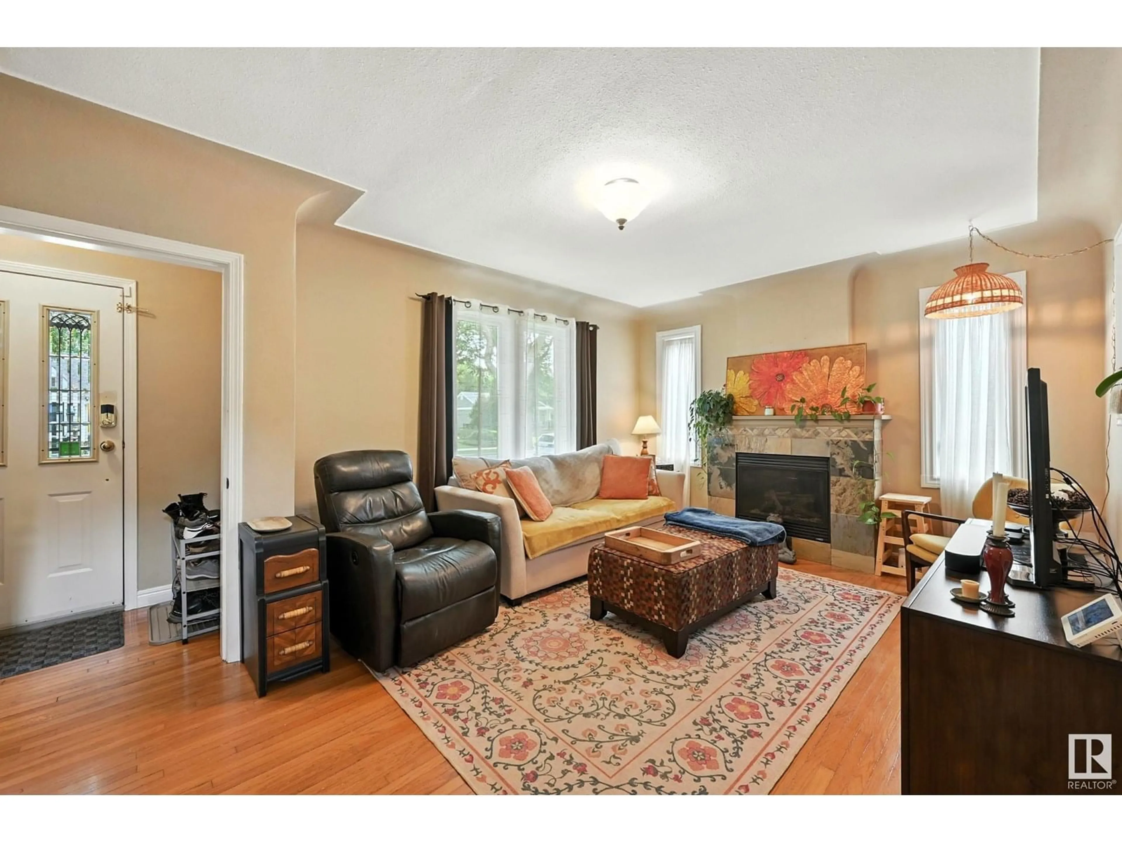 Living room with furniture, wood/laminate floor for 11322 60 ST, Edmonton Alberta T5W3Z1