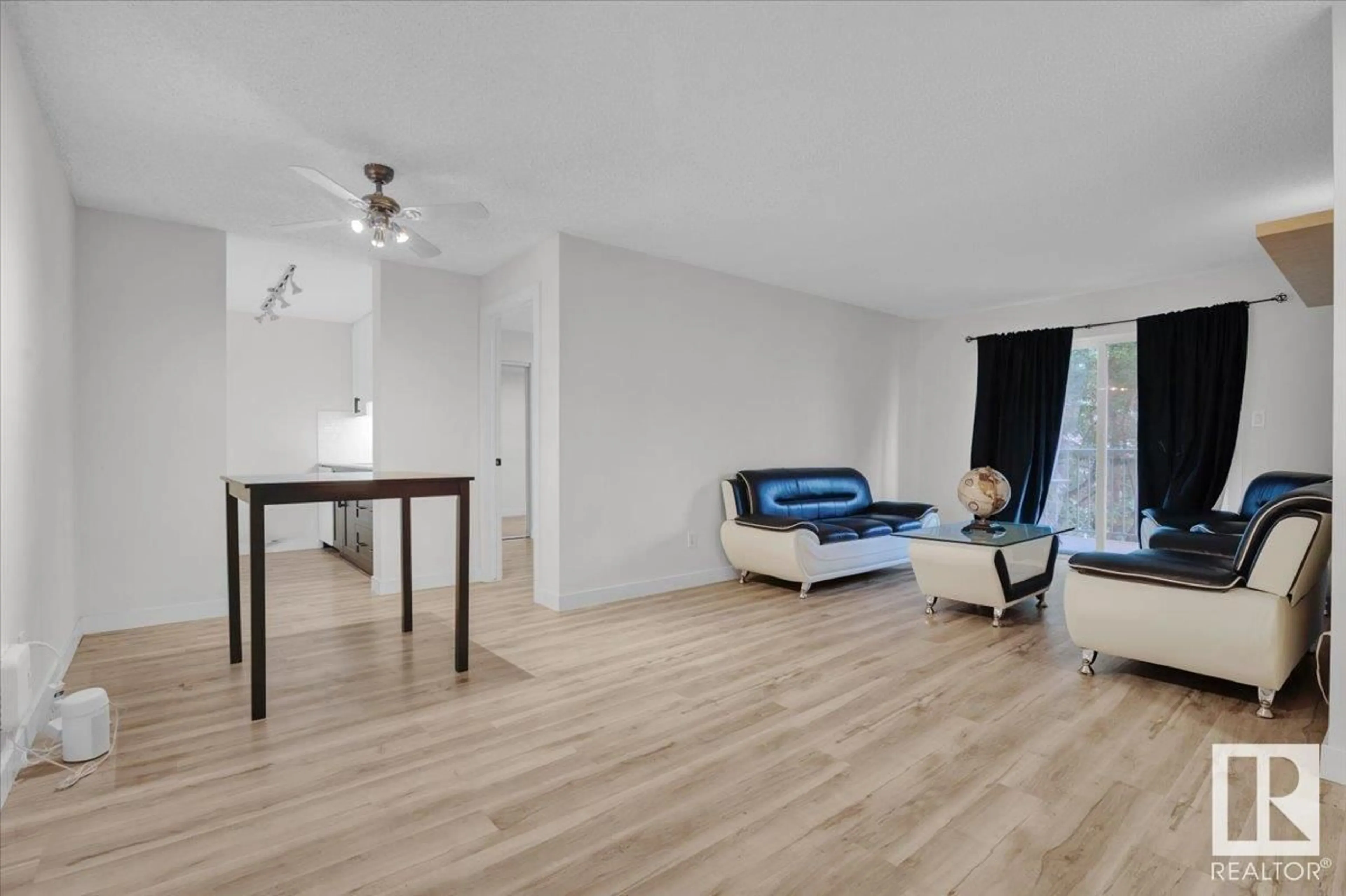 Living room with furniture, wood/laminate floor for #231 - 2520 50 ST, Edmonton Alberta T6L7A8