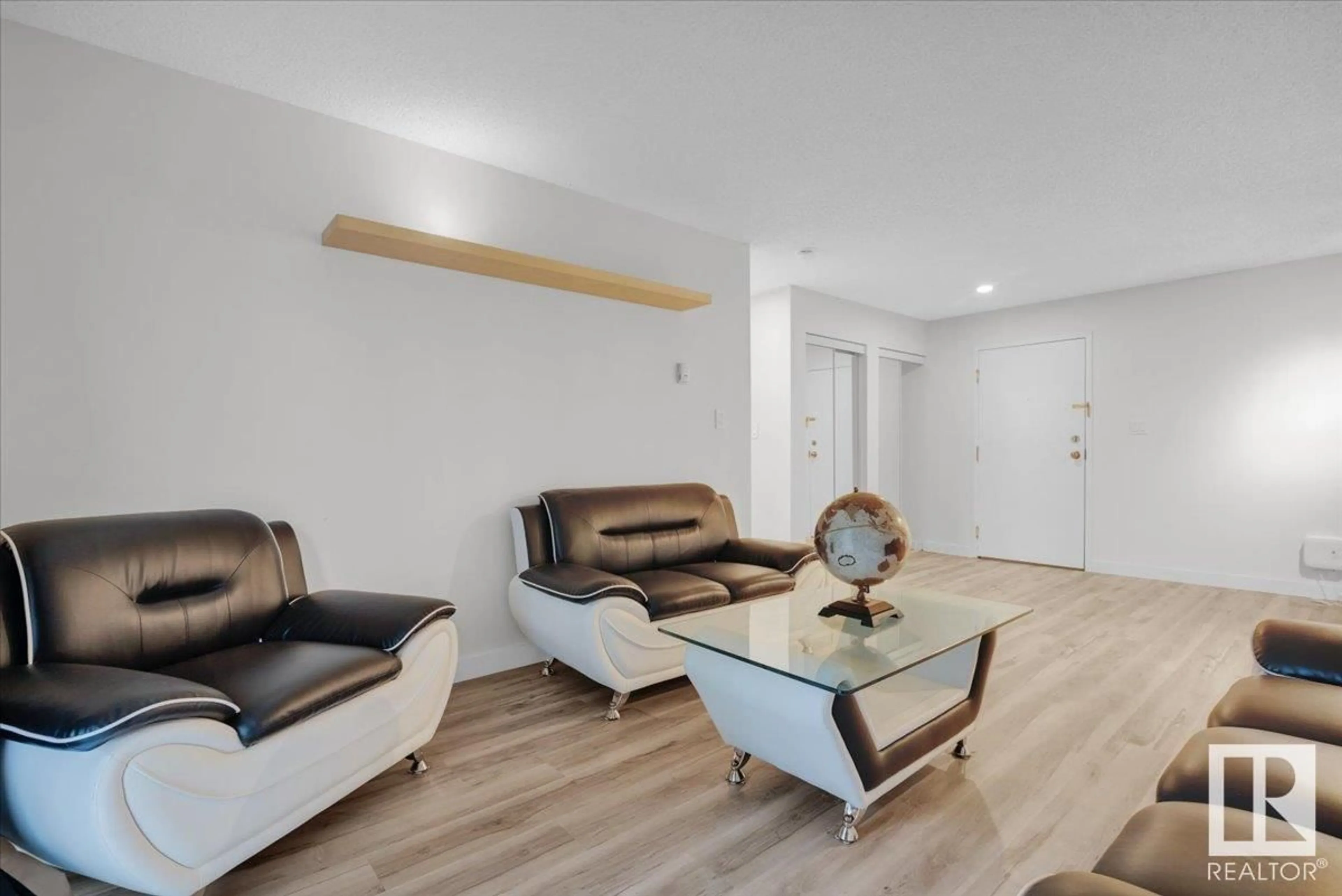 Living room with furniture, wood/laminate floor for #231 - 2520 50 ST, Edmonton Alberta T6L7A8