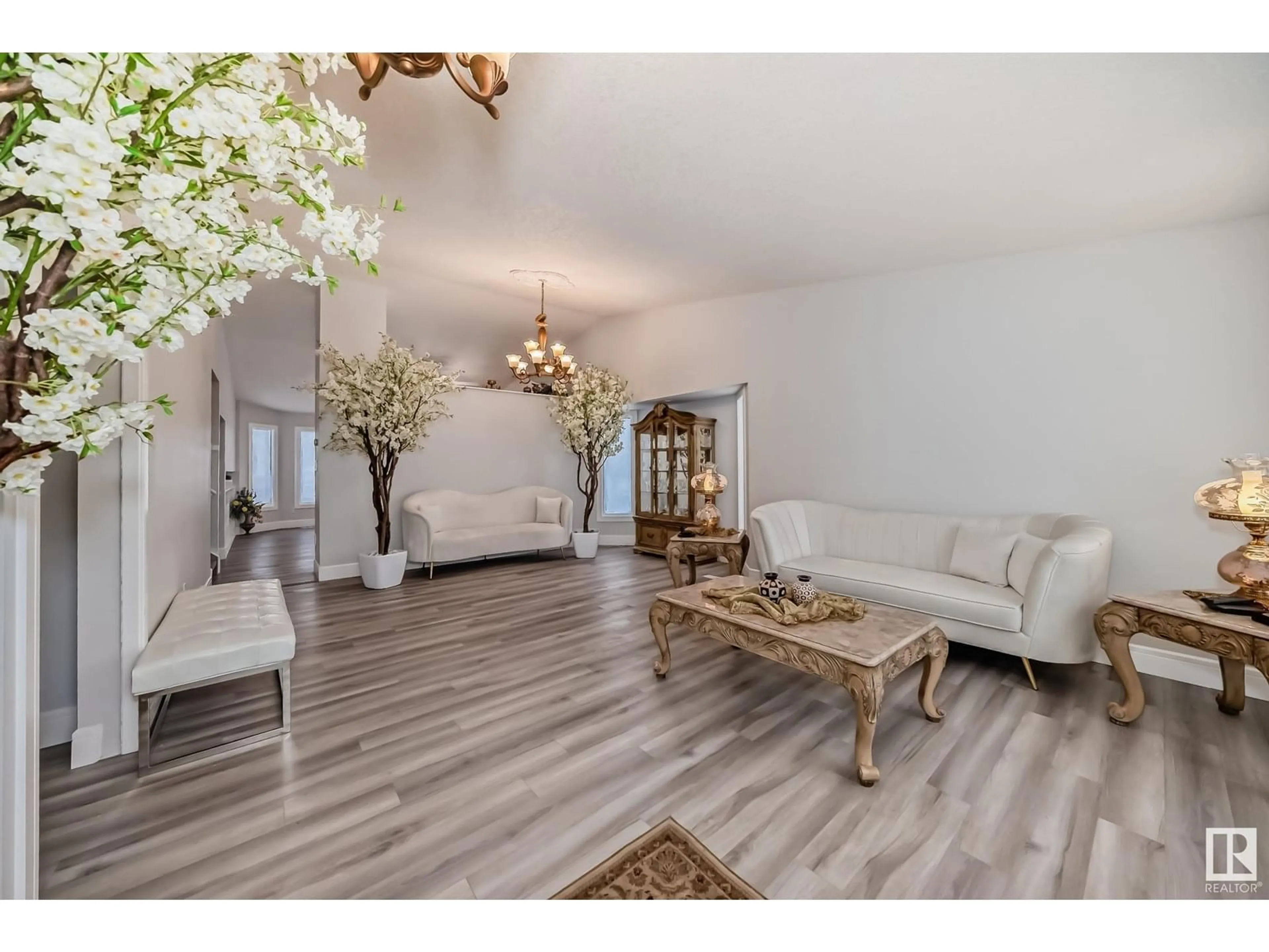 Living room with furniture, wood/laminate floor for 10735 BEAUMARIS RD, Edmonton Alberta T5X5P1