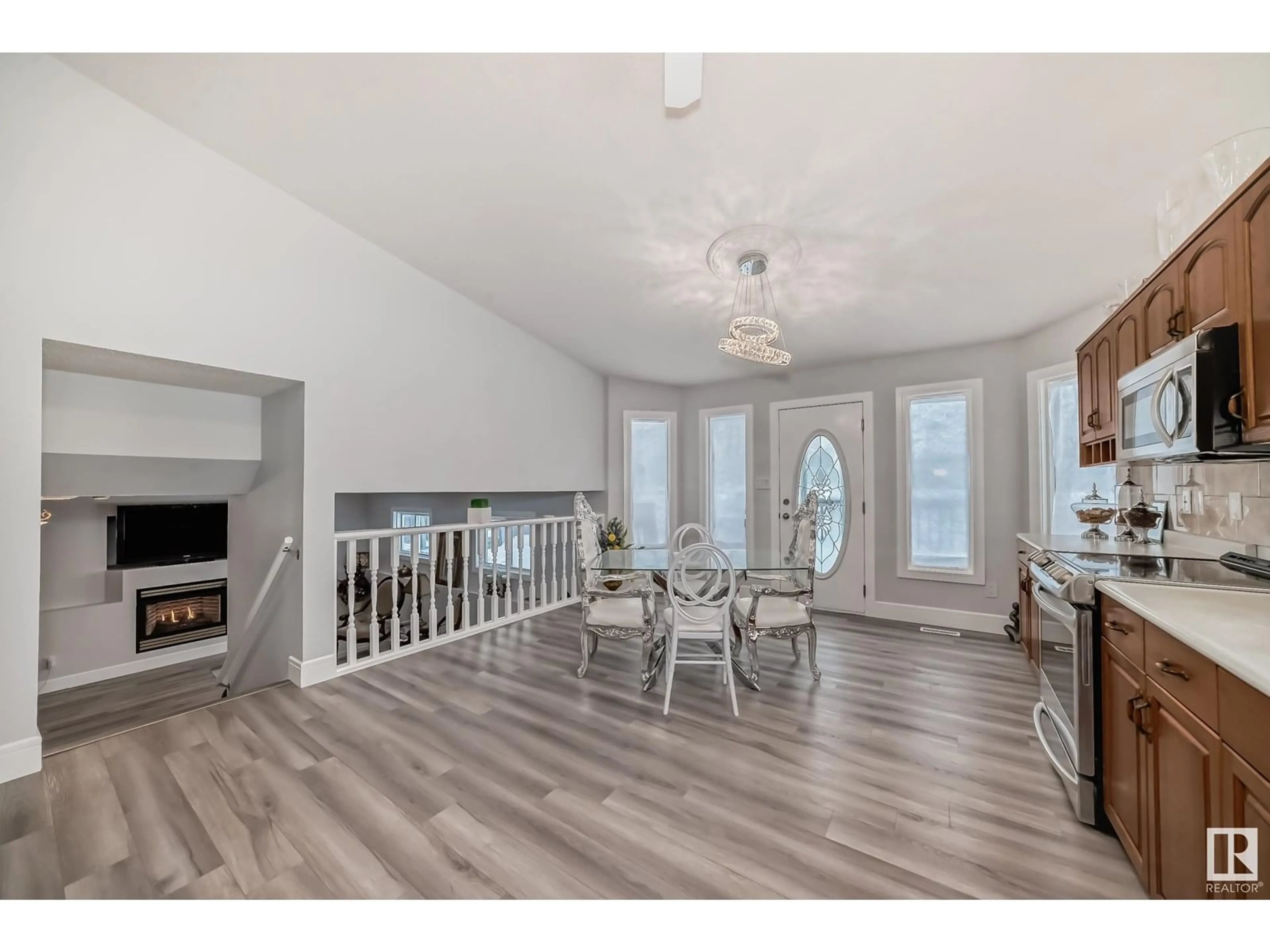 Open concept kitchen, wood/laminate floor for 10735 BEAUMARIS RD, Edmonton Alberta T5X5P1