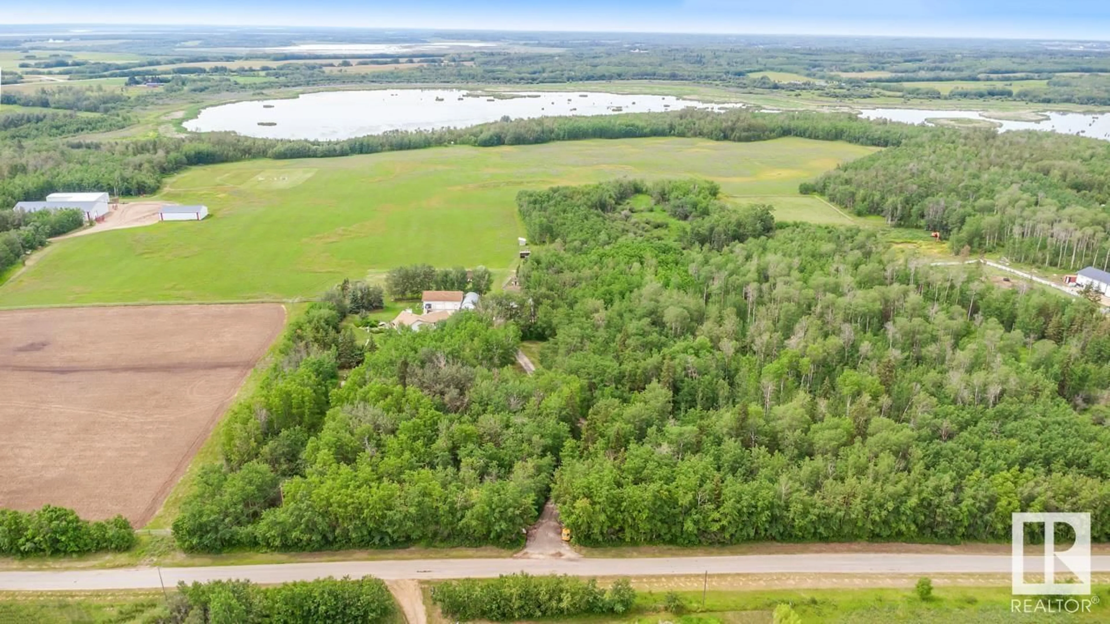 A pic from outside/outdoor area/front of a property/back of a property/a pic from drone, water/lake/river/ocean view for 52044 RGE ROAD 204, Rural Strathcona County Alberta T8G1G3
