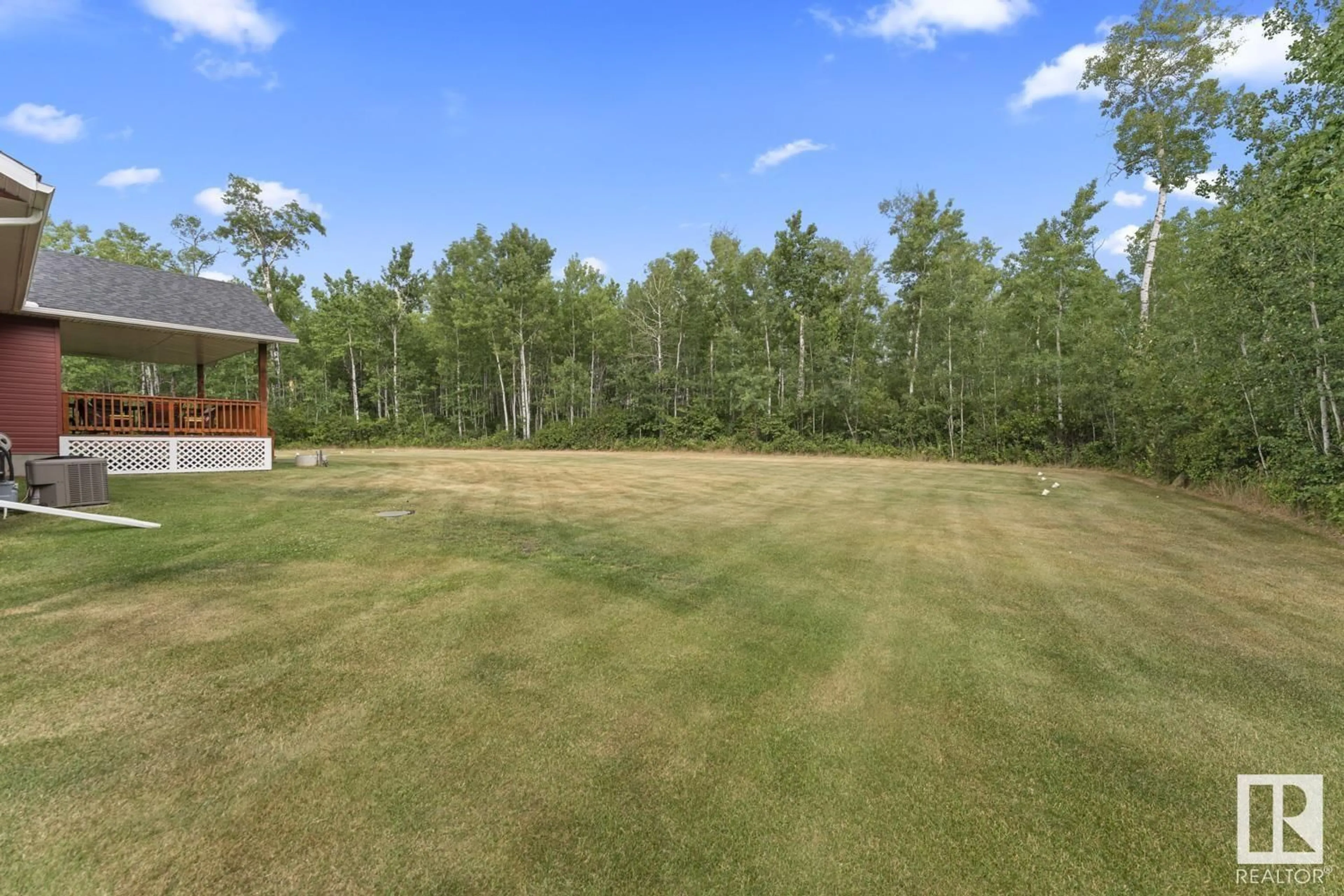 A pic from outside/outdoor area/front of a property/back of a property/a pic from drone, forest/trees view for 8 - 63220 RR 433, Rural Bonnyville M.D. Alberta T9M1P2