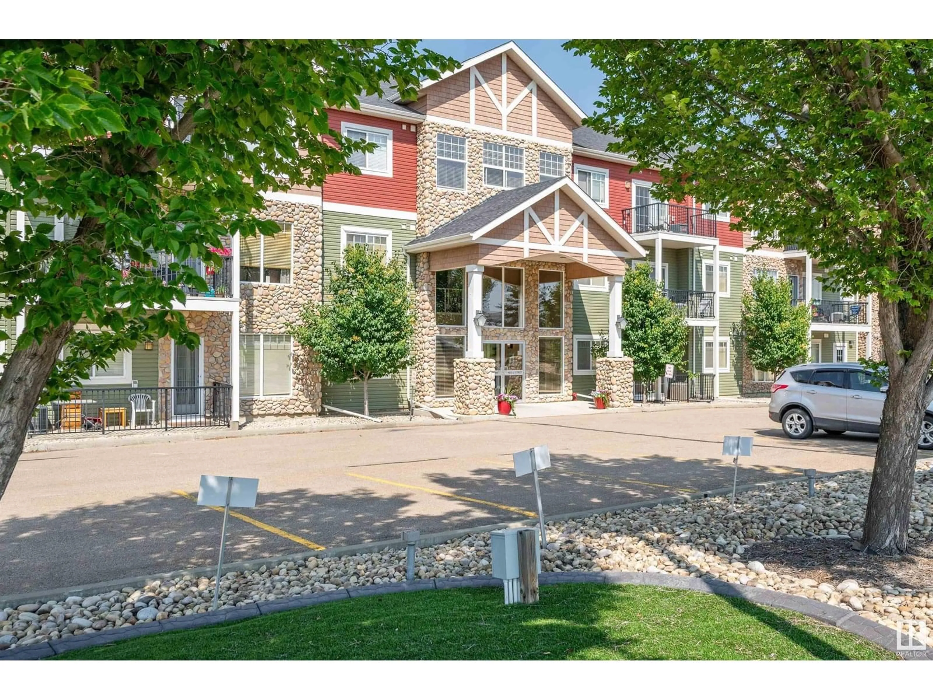 A pic from outside/outdoor area/front of a property/back of a property/a pic from drone, street for #109 - 4922 52 ST, Gibbons Alberta T0A1N0