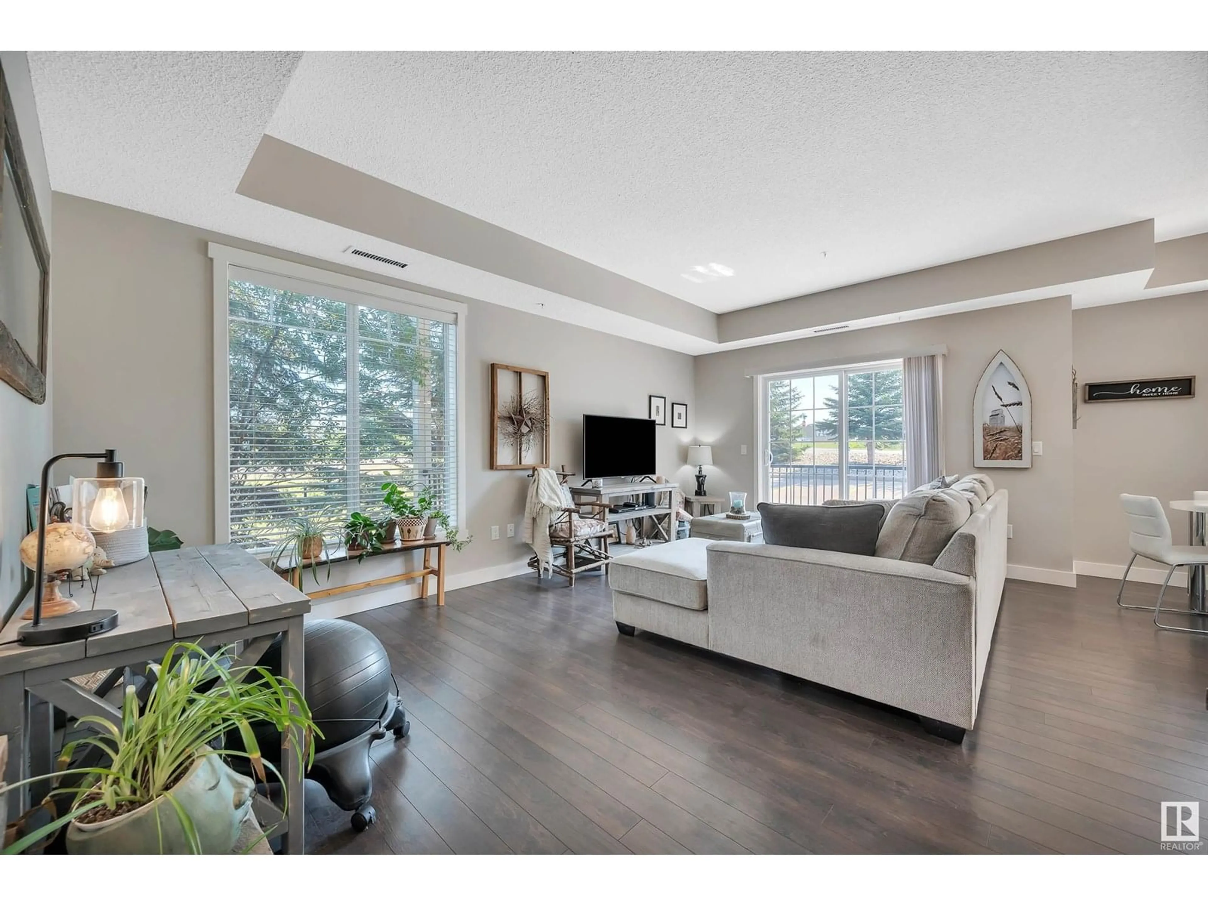 Living room with furniture, wood/laminate floor for #109 - 4922 52 ST, Gibbons Alberta T0A1N0