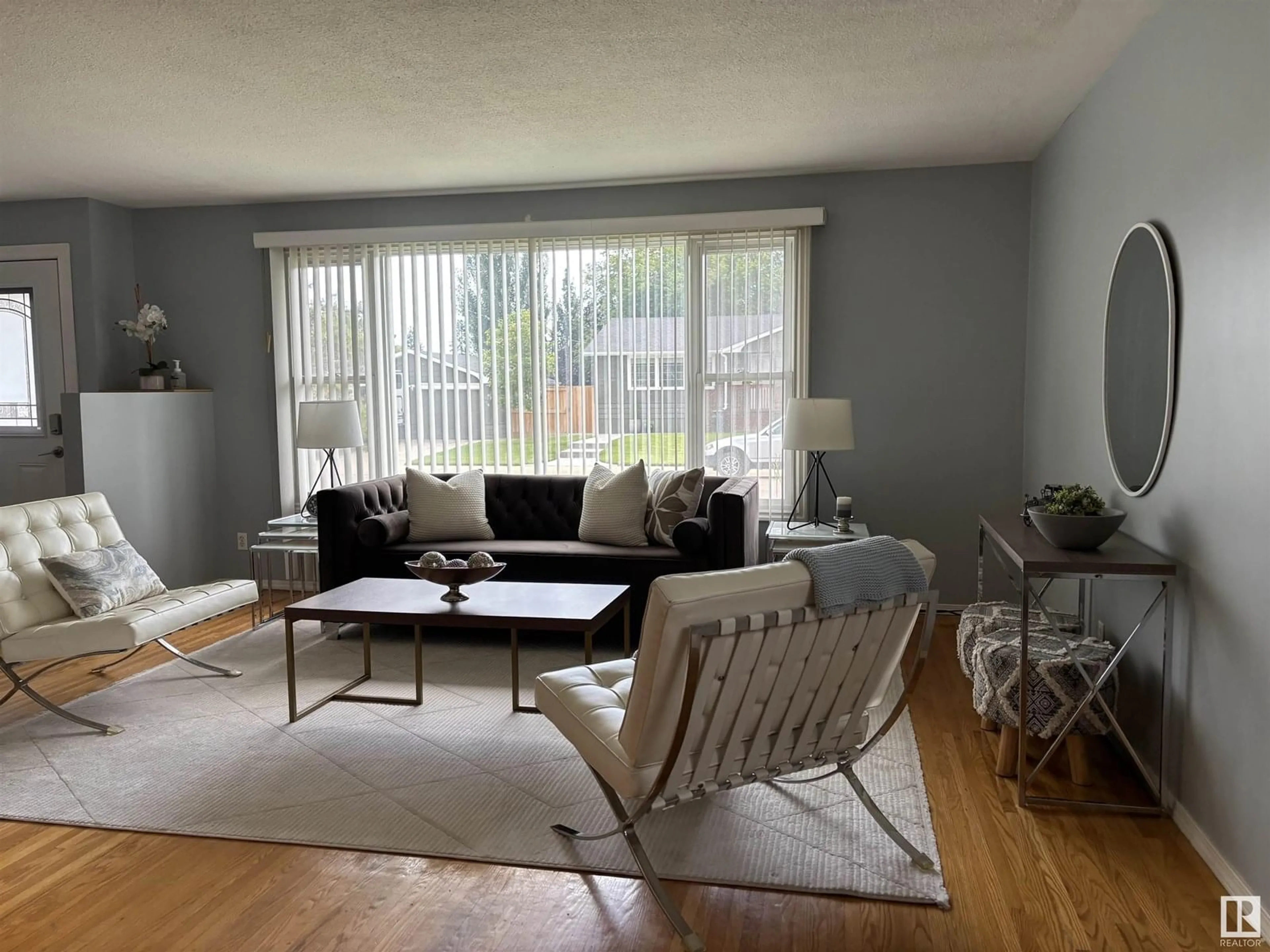 Living room with furniture, wood/laminate floor for 15014 83 AV, Edmonton Alberta T5R3T2