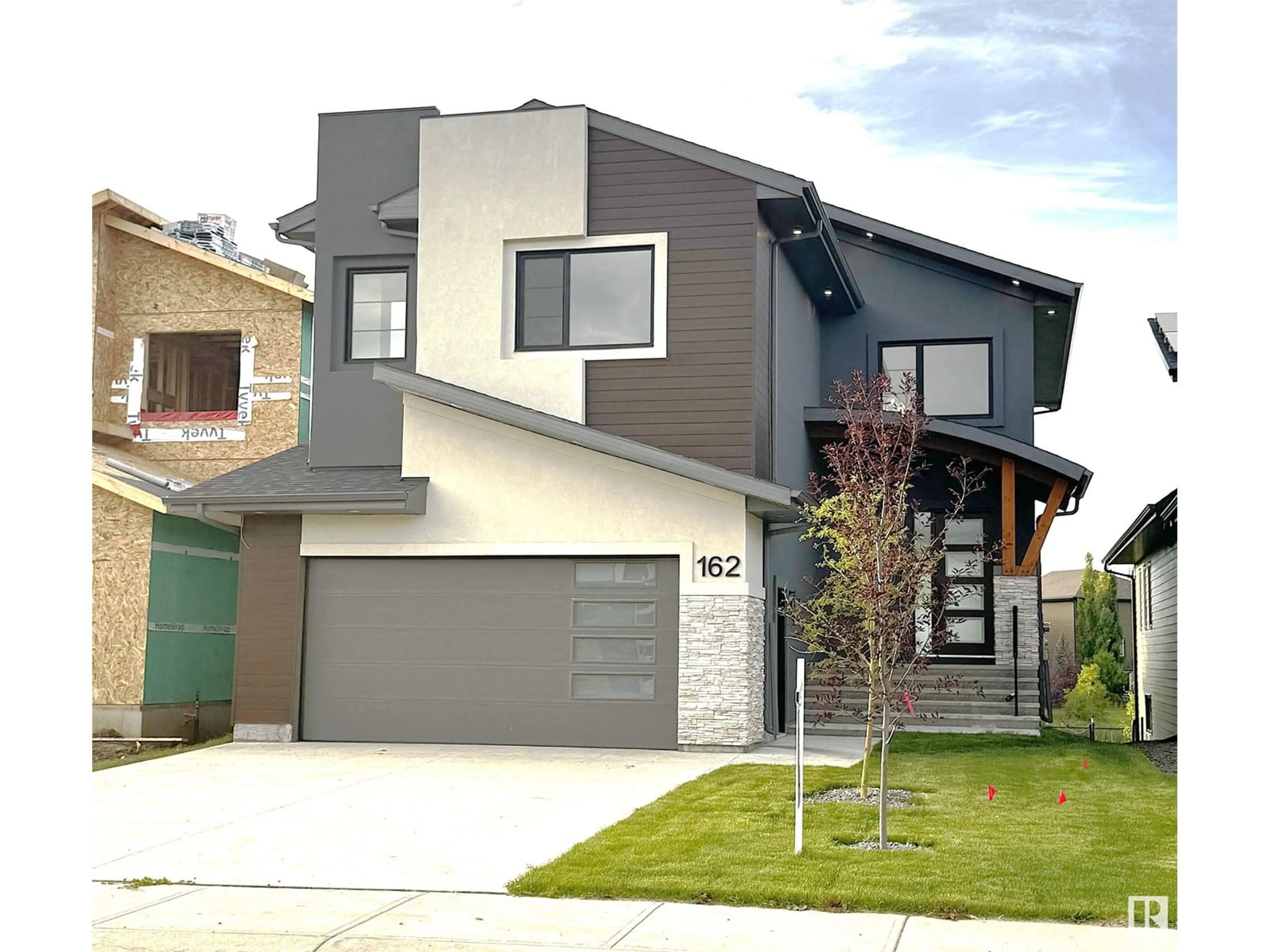 Home with vinyl exterior material, street for 162 EDGEWATER CI, Leduc Alberta T9E1K5