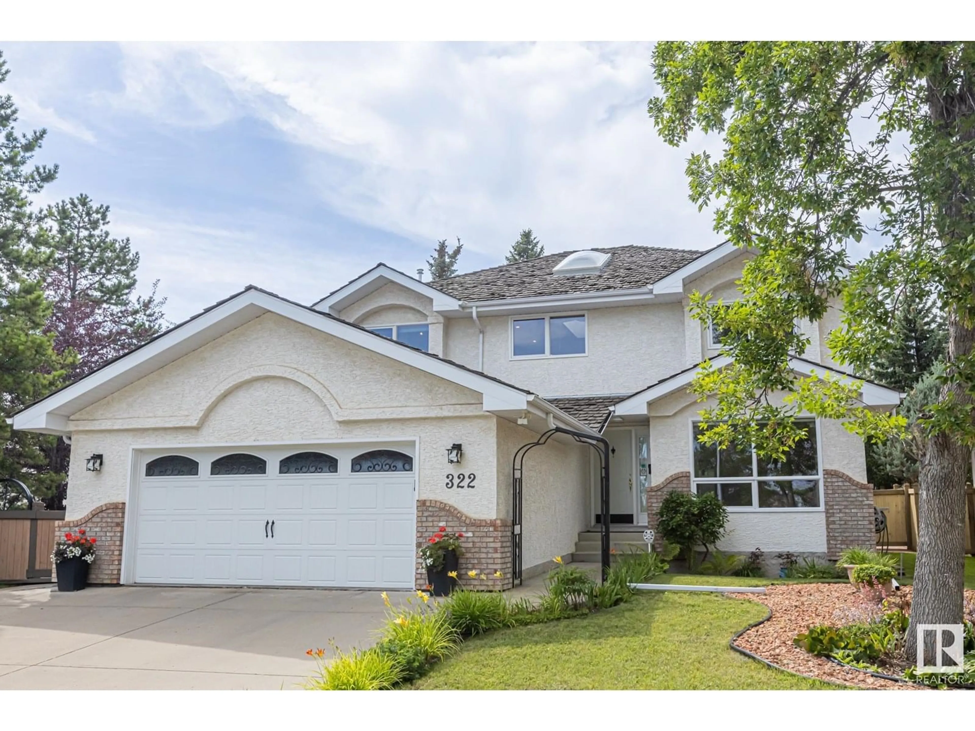 Home with vinyl exterior material, street for 322 BURTON RD, Edmonton Alberta T6R2G7
